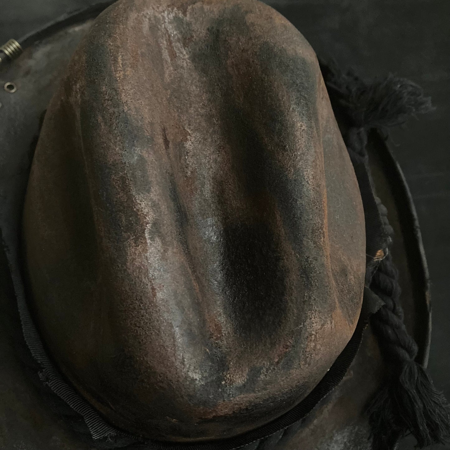 Hard burned dark western hat