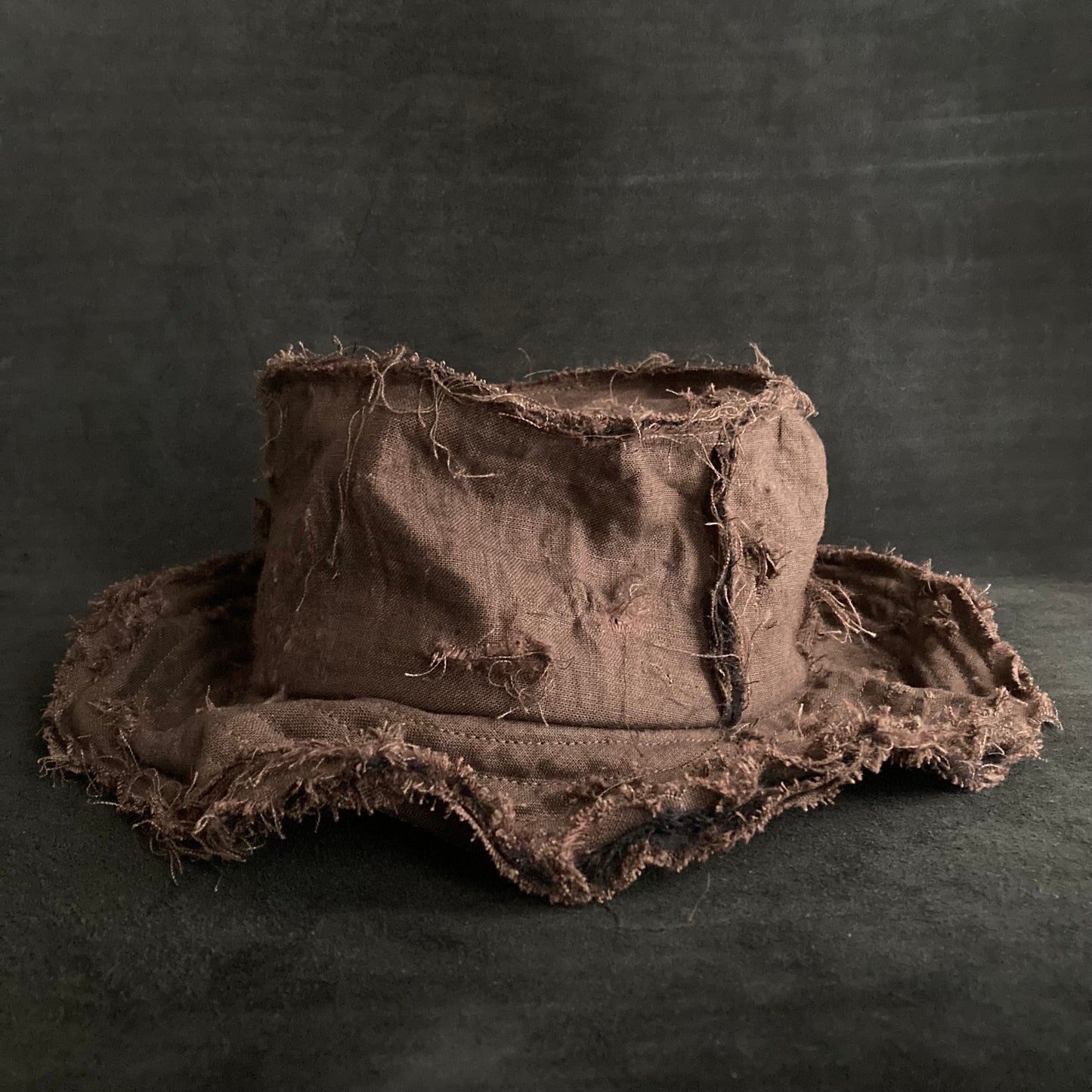 Back side brown linen damage bucket hat