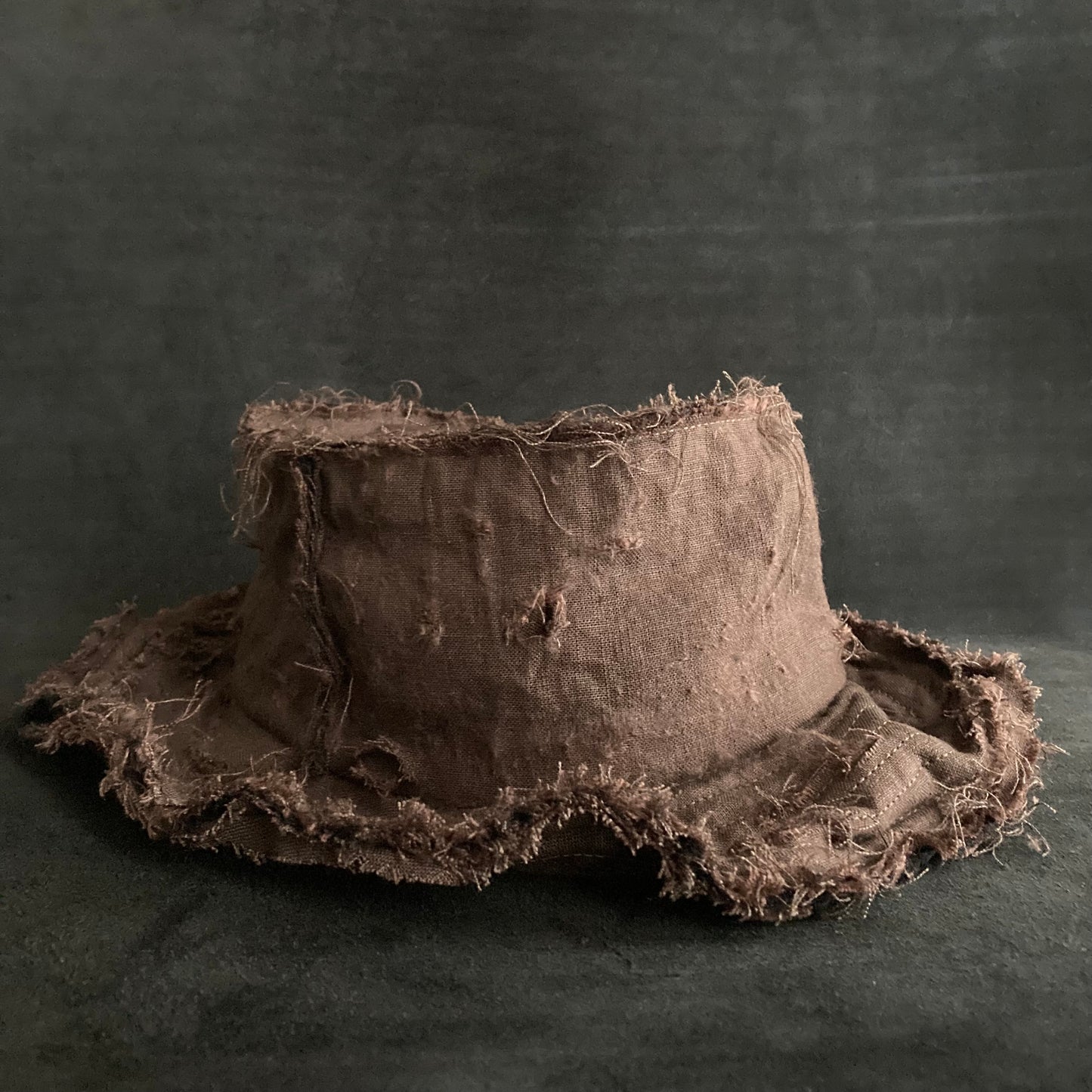 Back side brown linen damage bucket hat