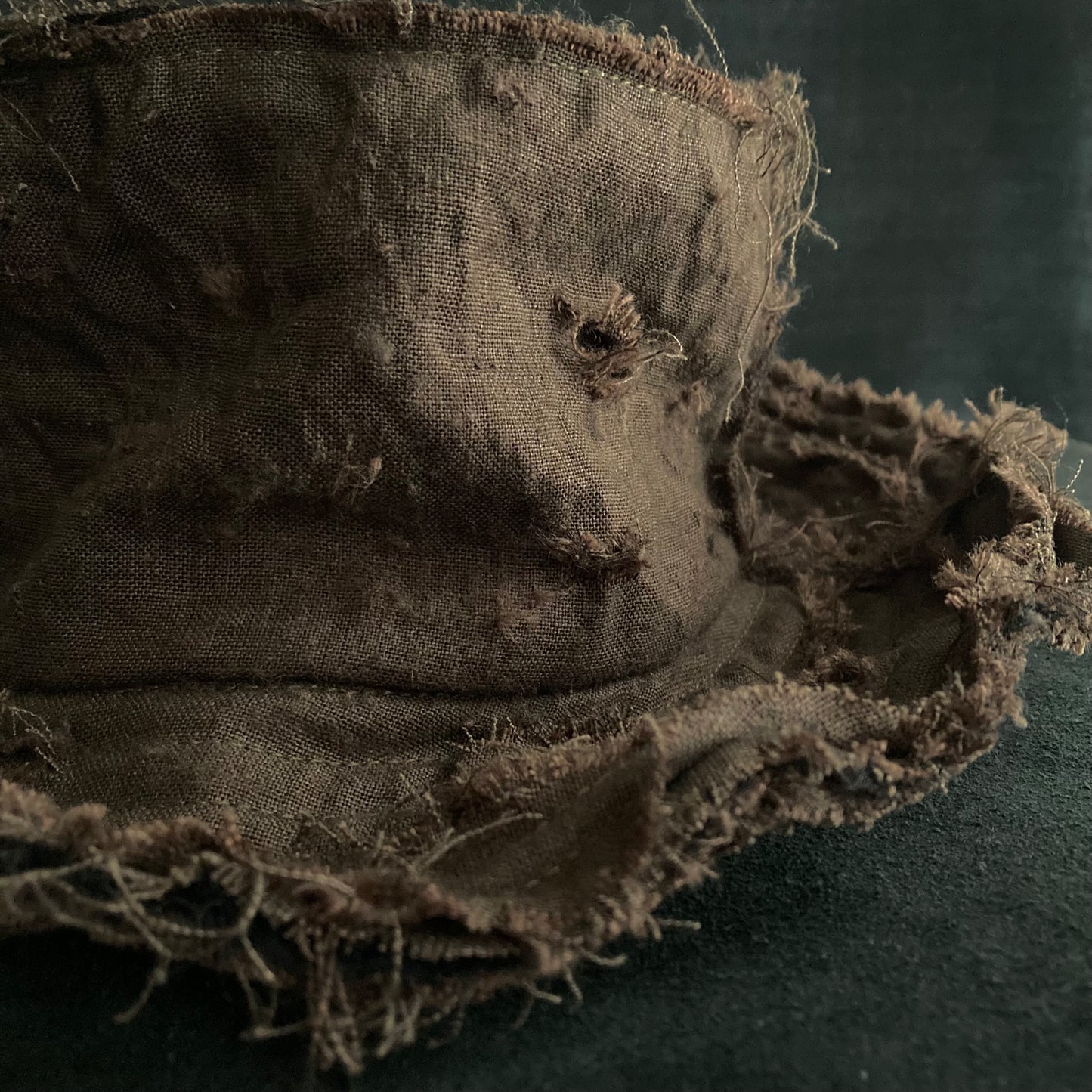 Back side brown linen damage bucket hat