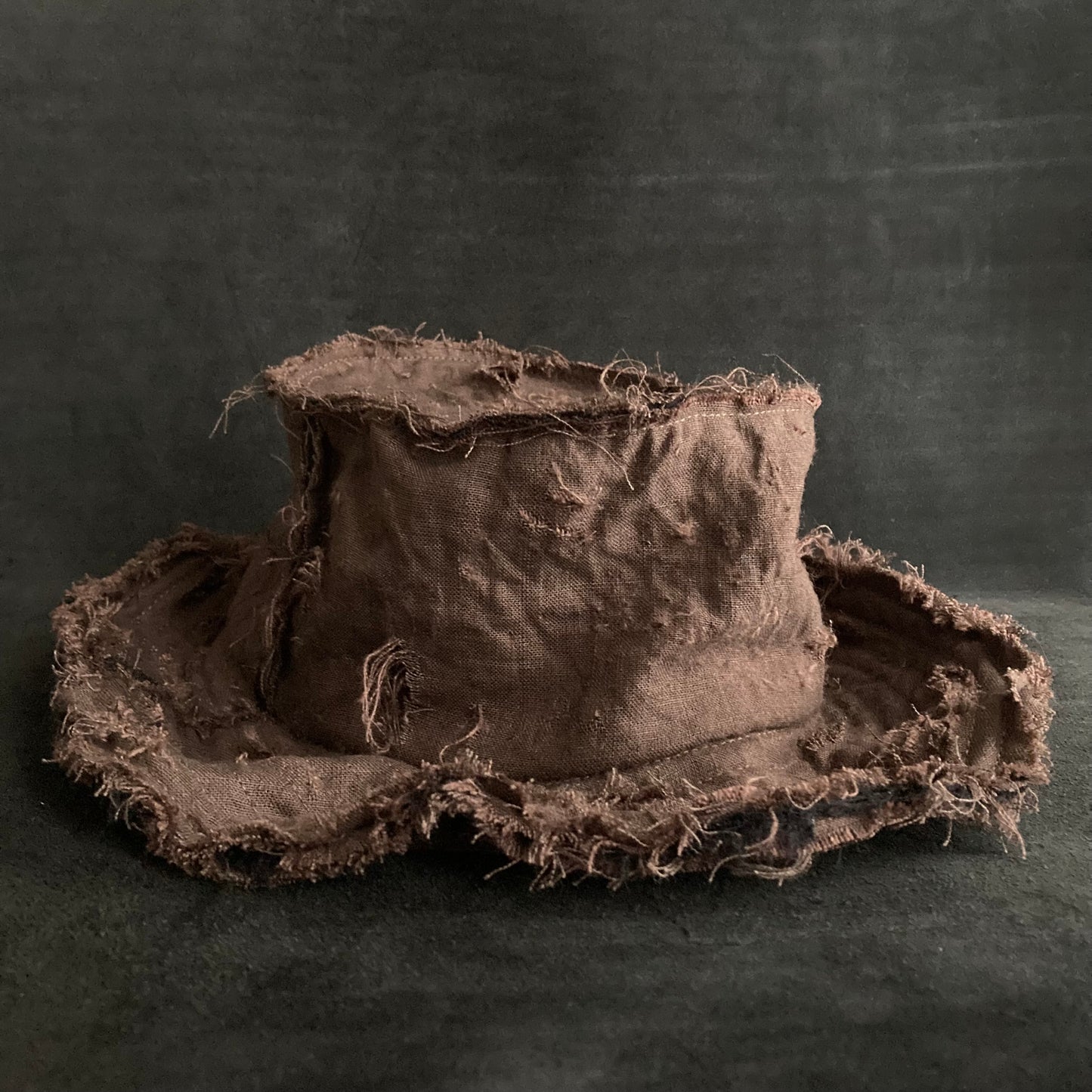 Back side brown linen damage bucket hat