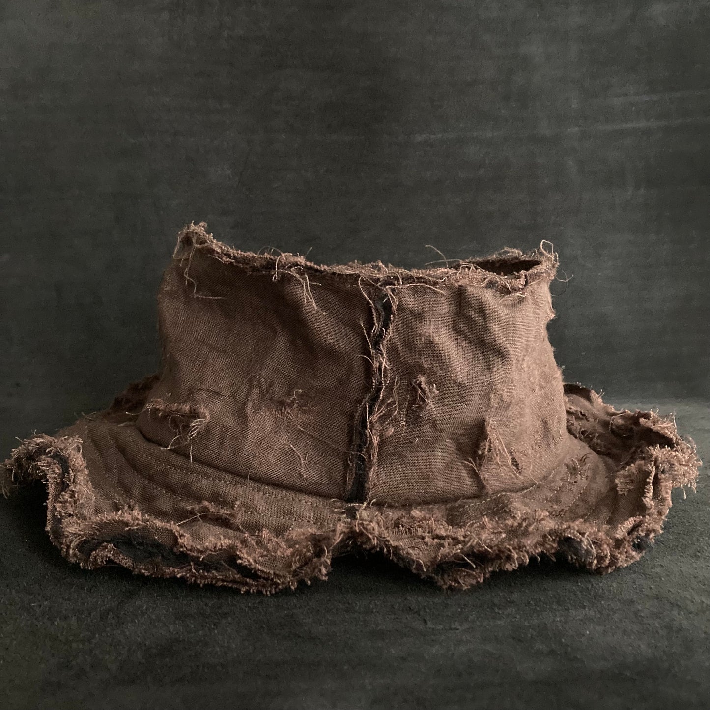 Back side brown linen damage bucket hat