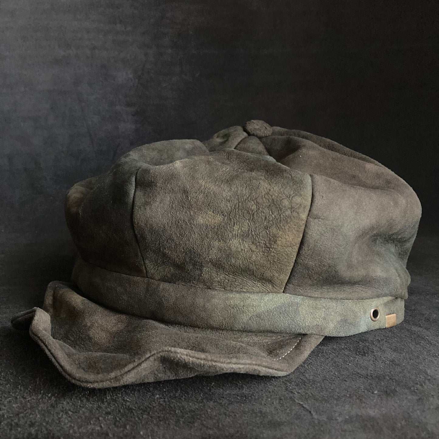 Muddy dark color leather casquette