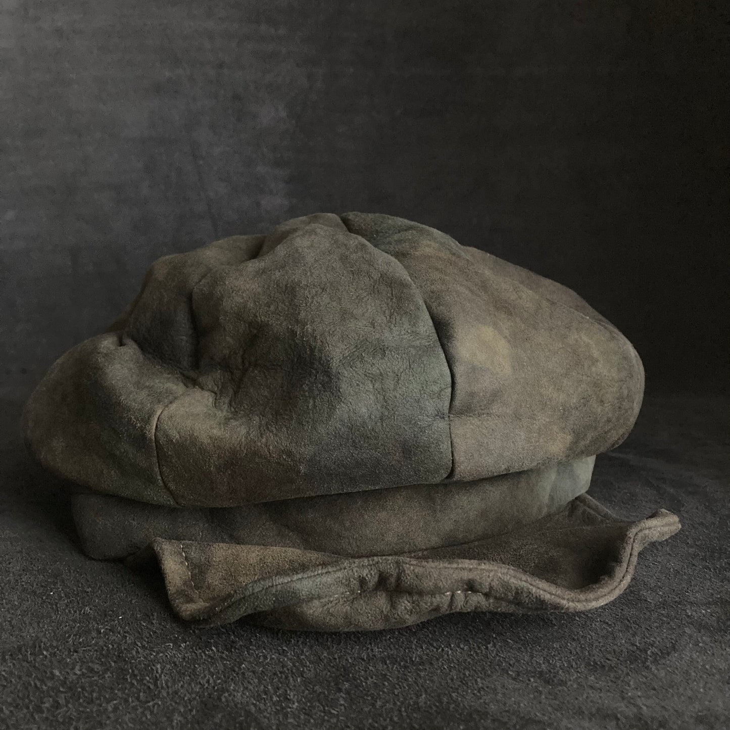 Muddy dark color leather casquette