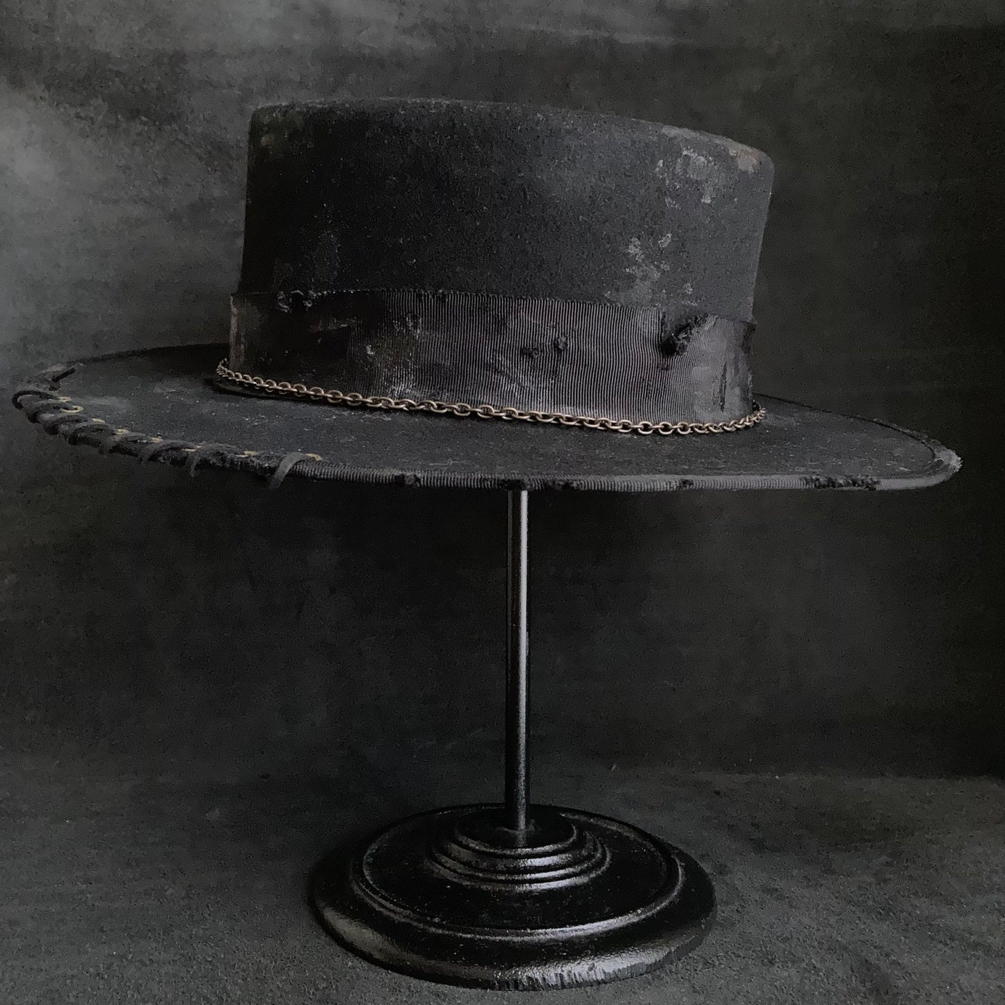 Dirt black old flat hat