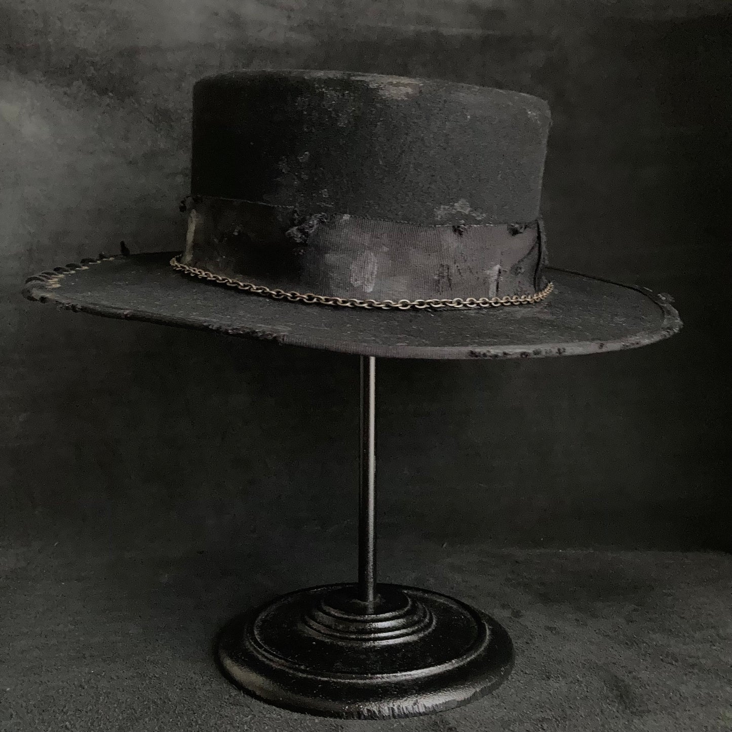 Dirt black old flat hat