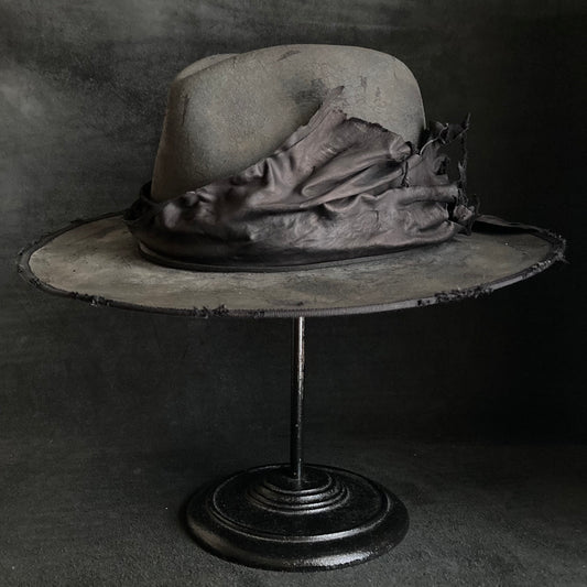 Charcoal leather erodes fedora hat