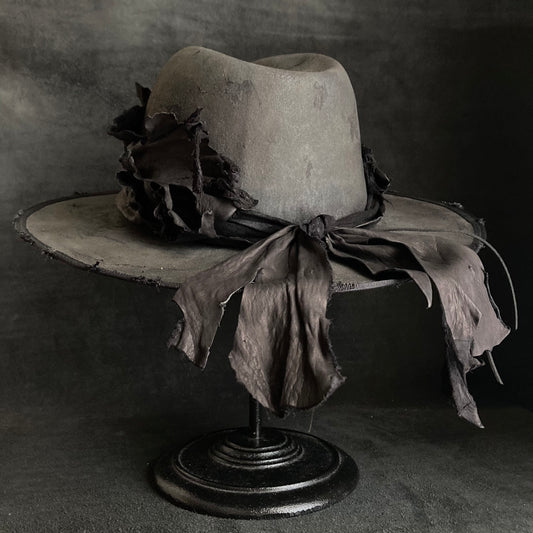 Charcoal leather erodes fedora hat