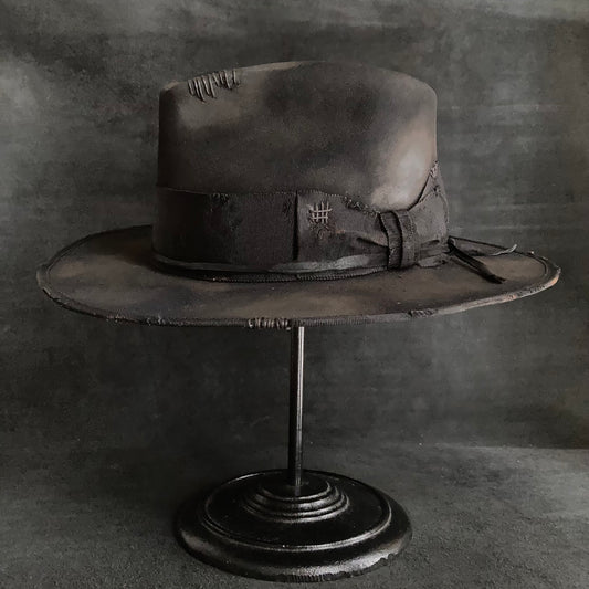 Damaged black rabbit fedora