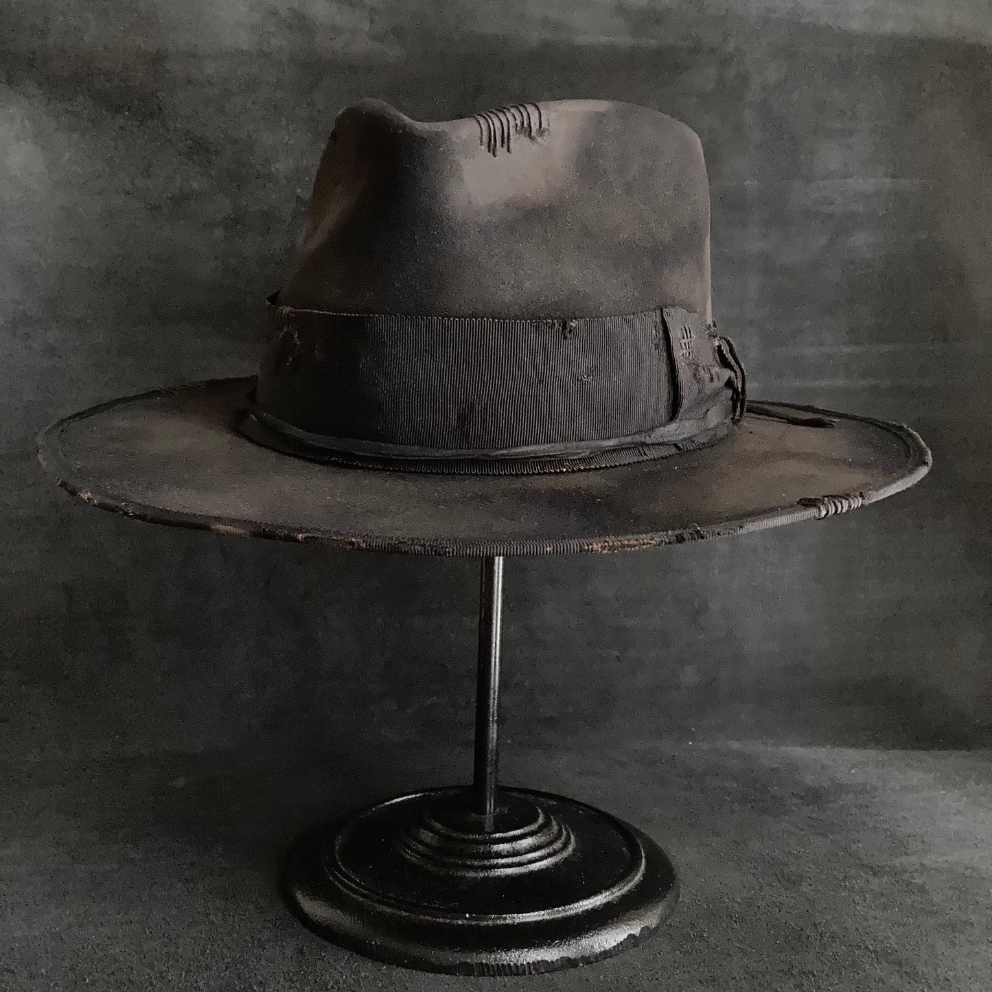 Damaged black rabbit fedora