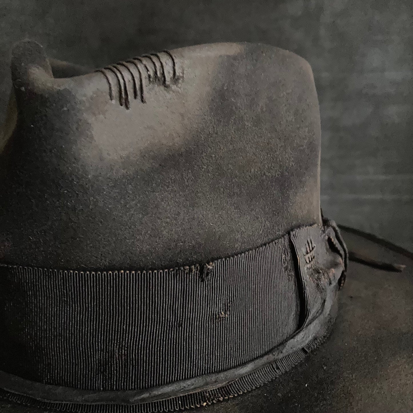 Damaged black rabbit fedora