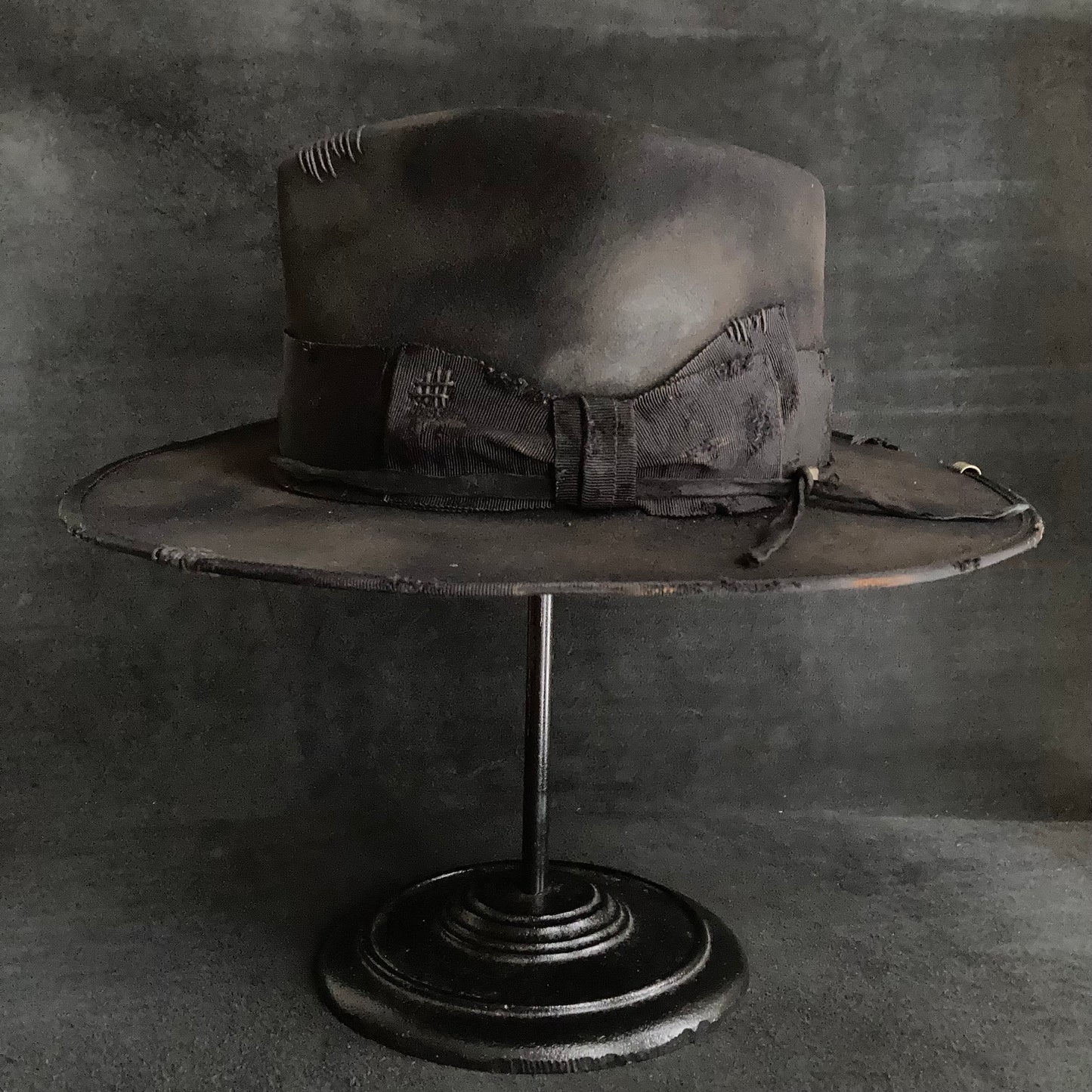 Damaged black rabbit fedora