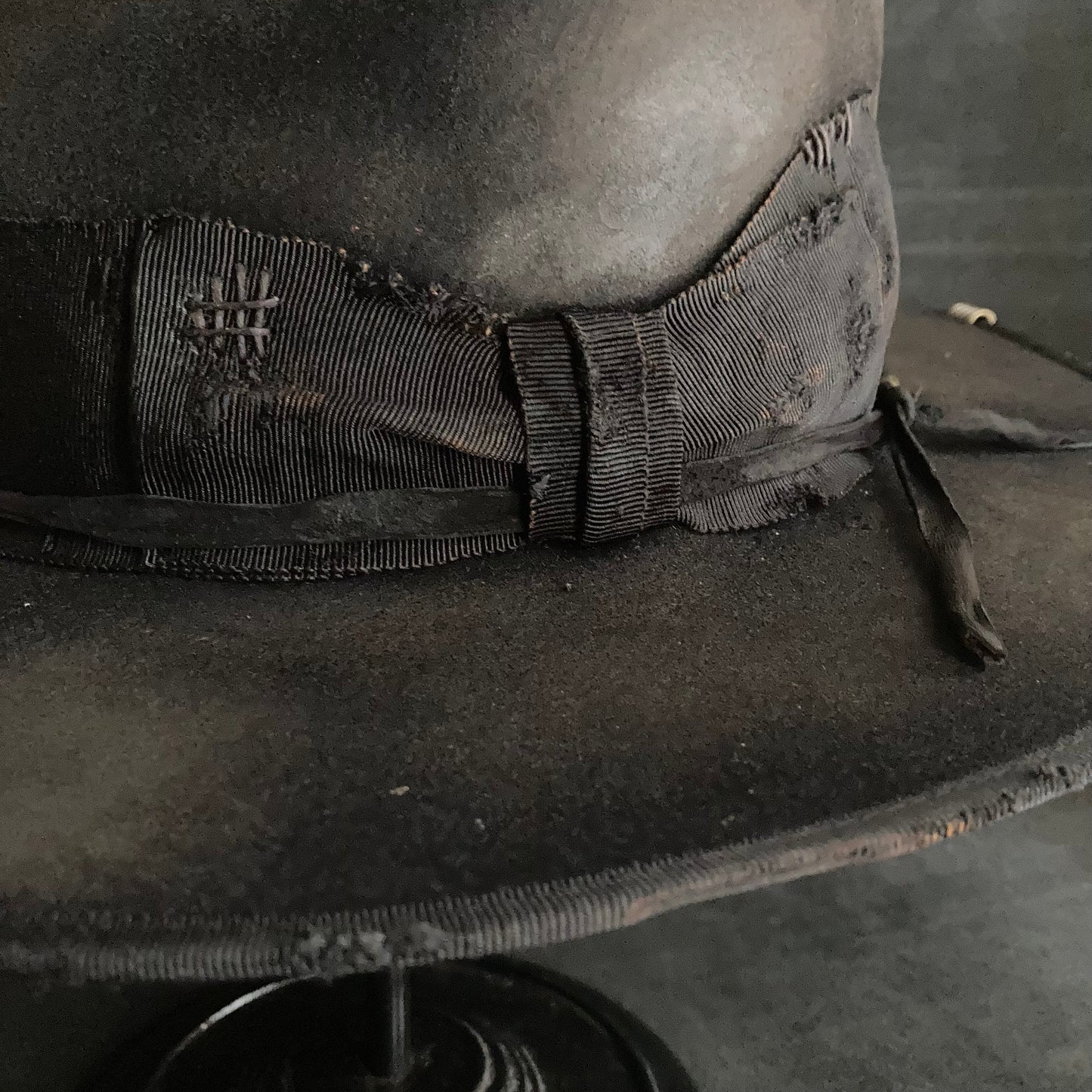 Damaged black rabbit fedora