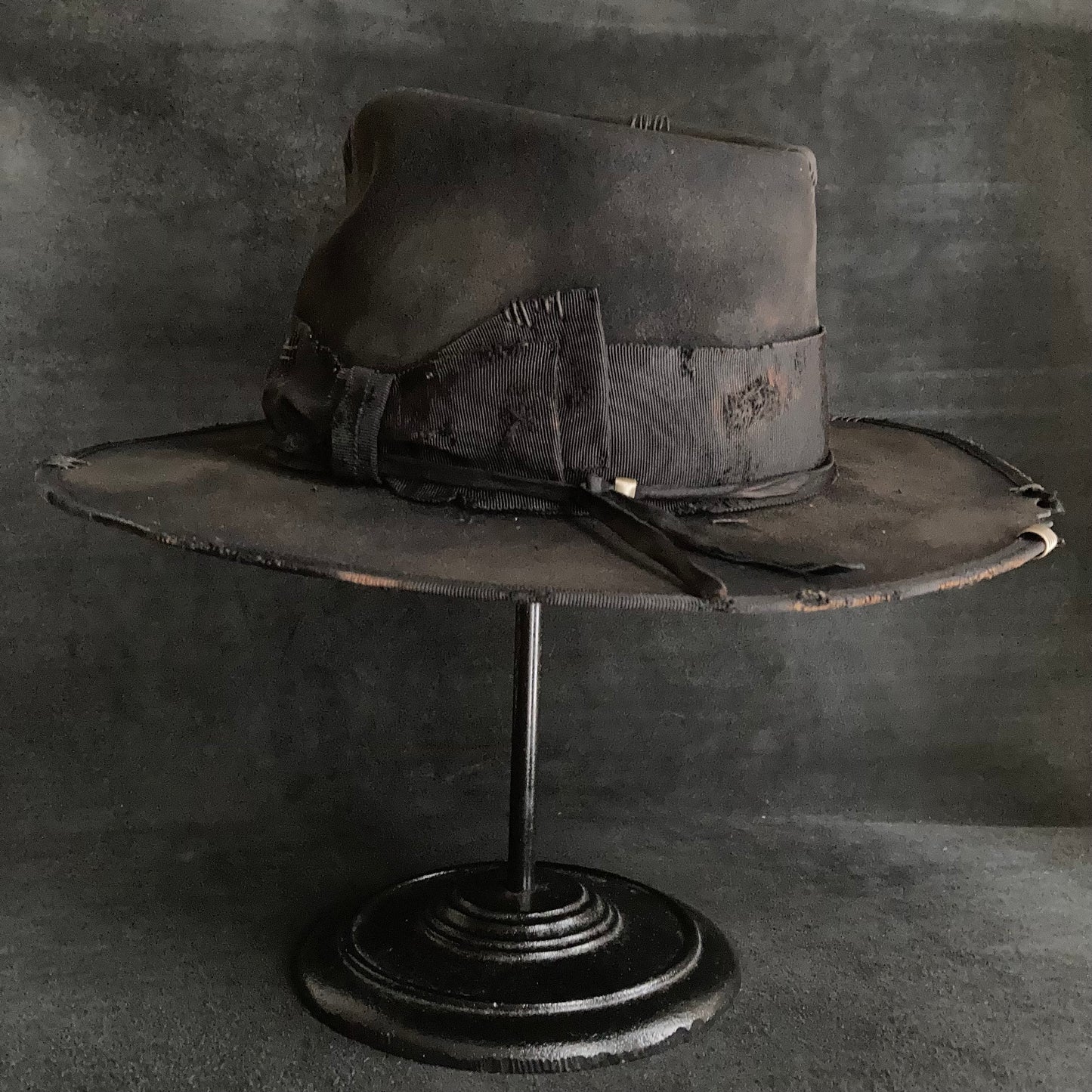 Damaged black rabbit fedora