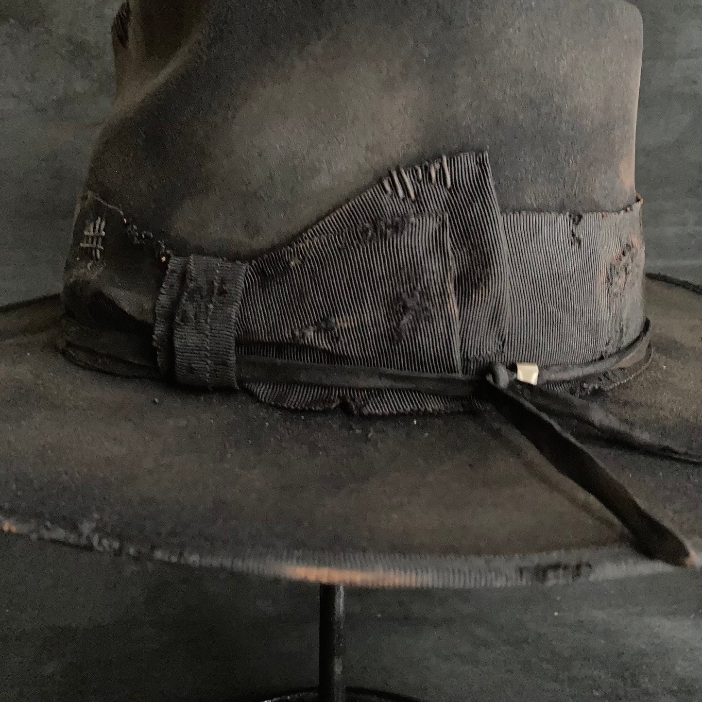 Damaged black rabbit fedora