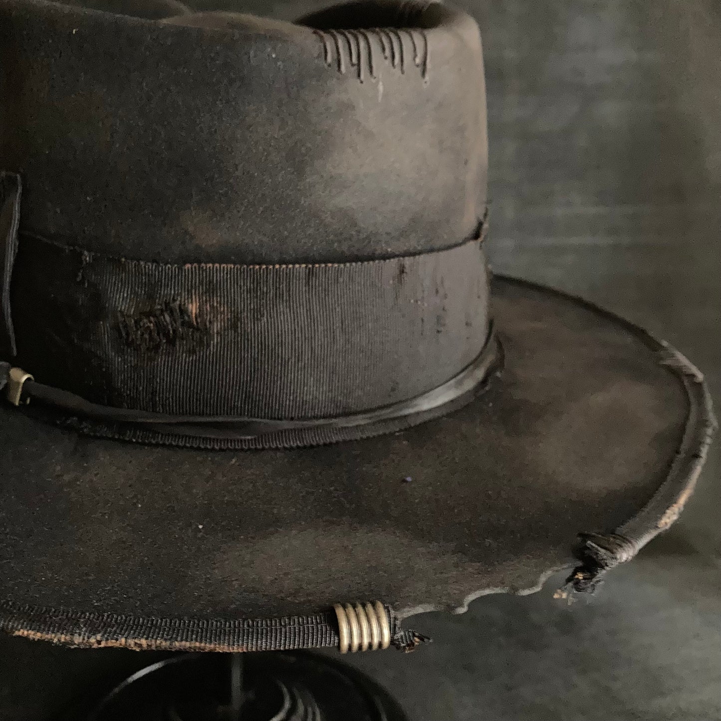 Damaged black rabbit fedora