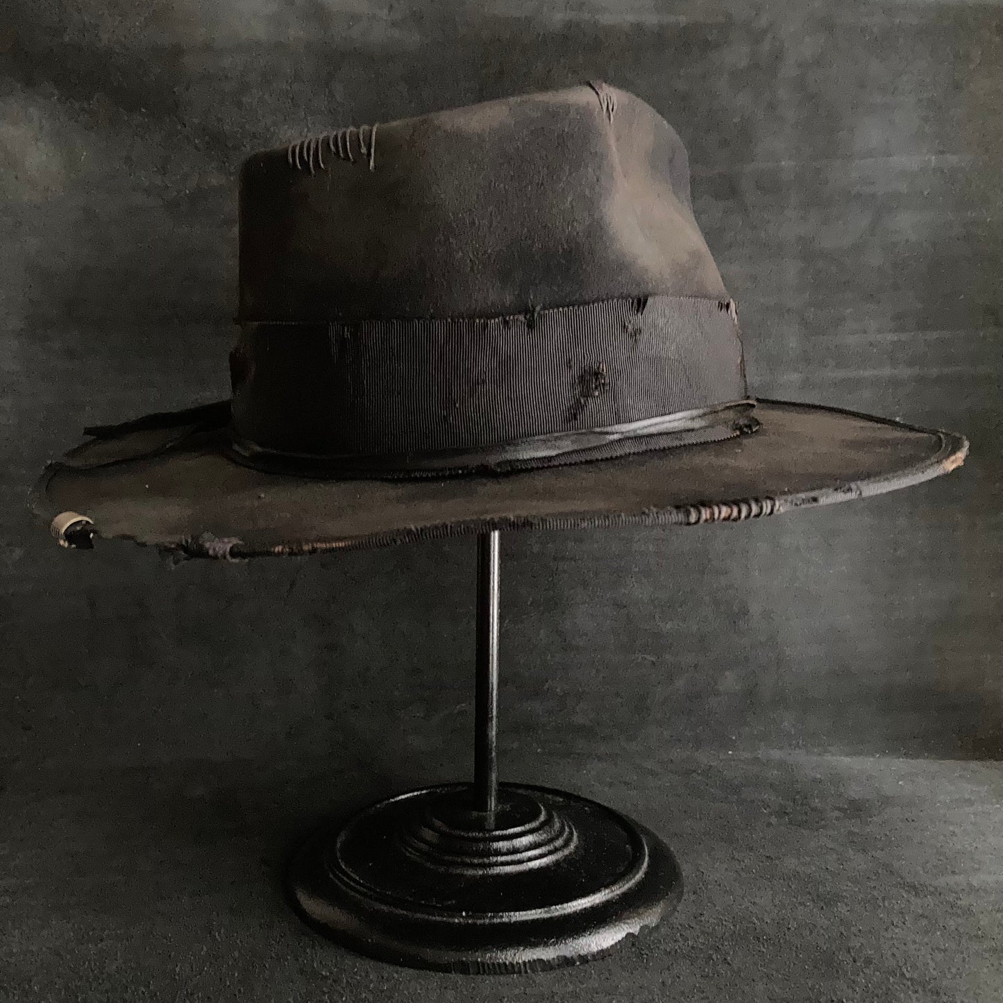 Damaged black rabbit fedora