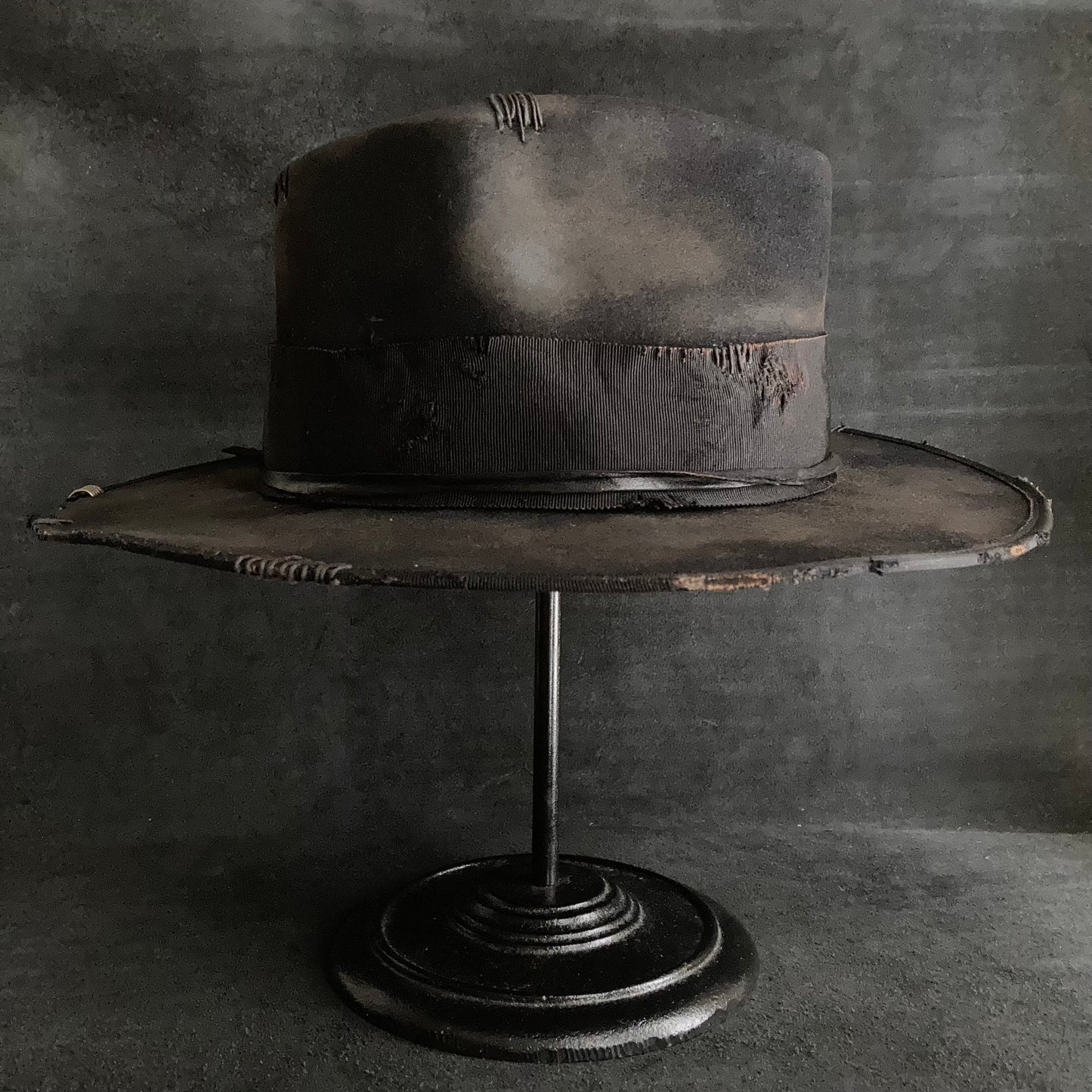 Damaged black rabbit fedora