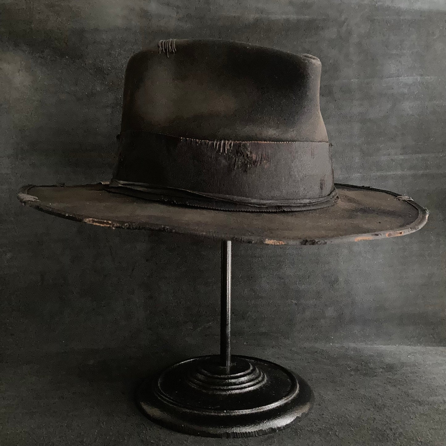 Damaged black rabbit fedora