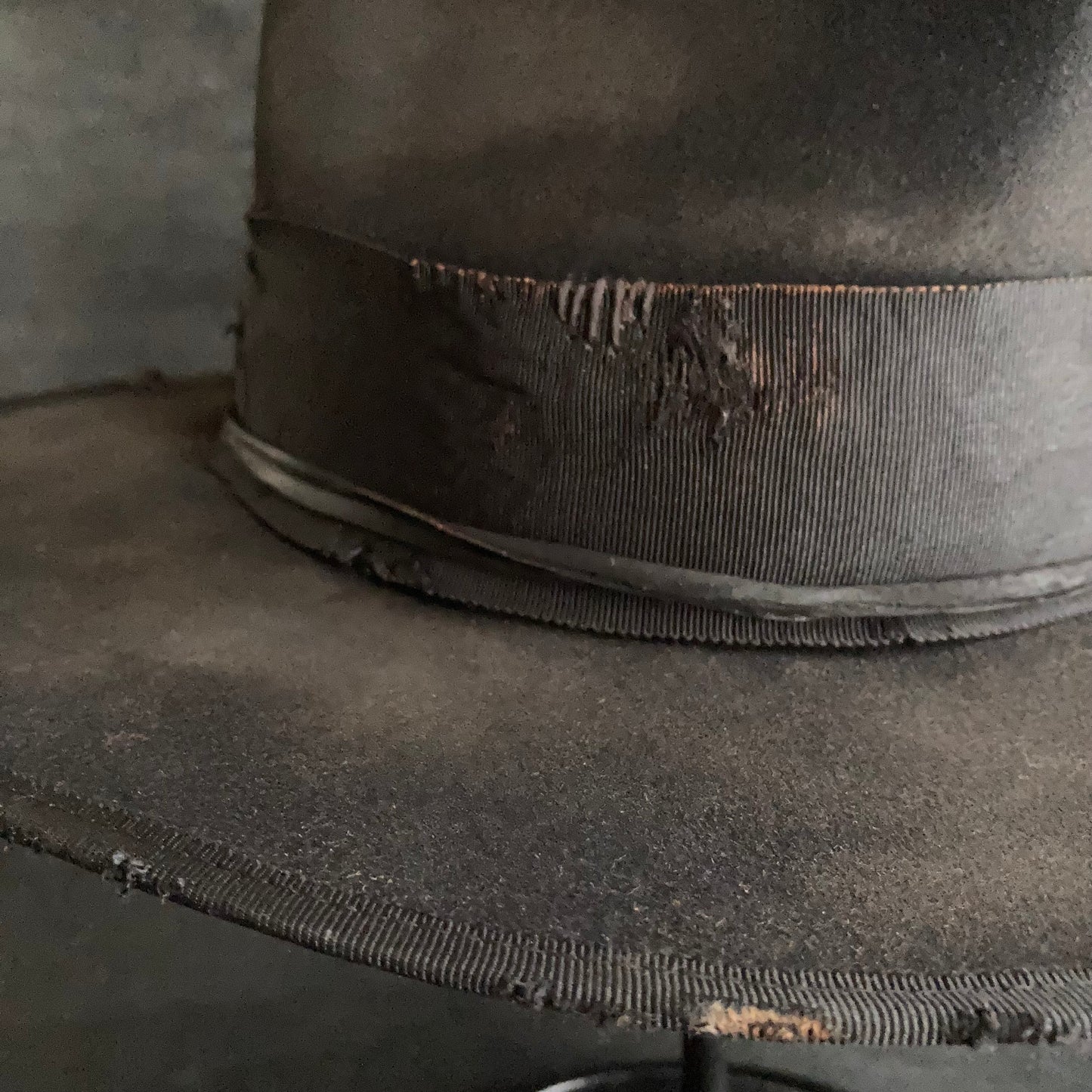 Damaged black rabbit fedora