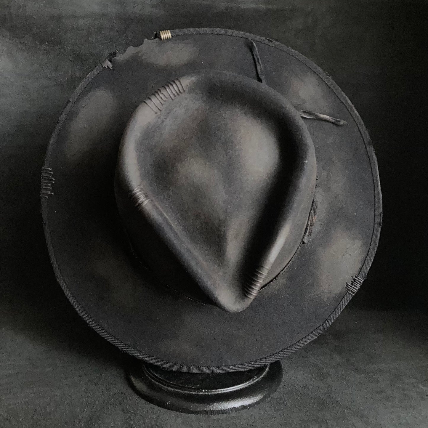 Damaged black rabbit fedora