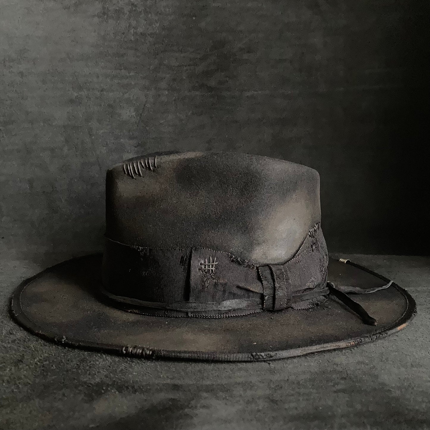 Damaged black rabbit fedora