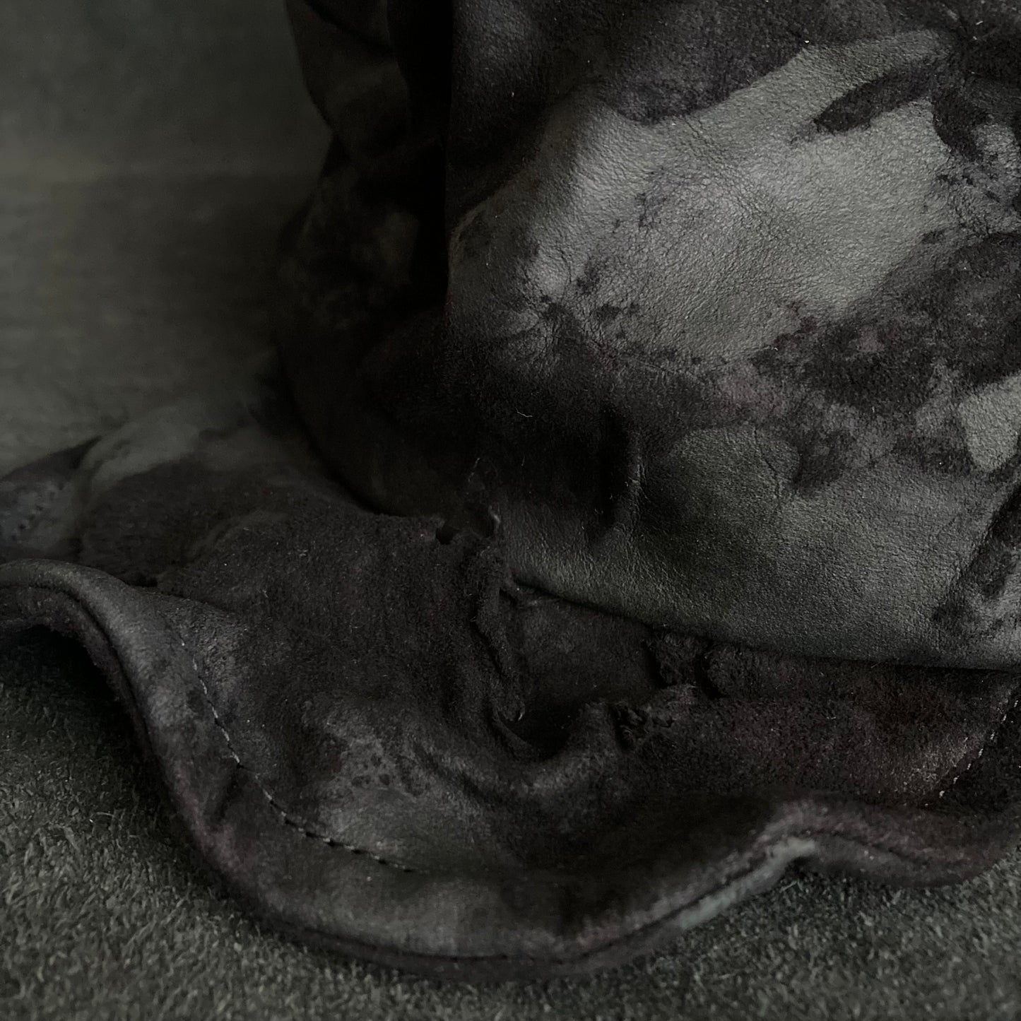 Bleached black leather turn cap