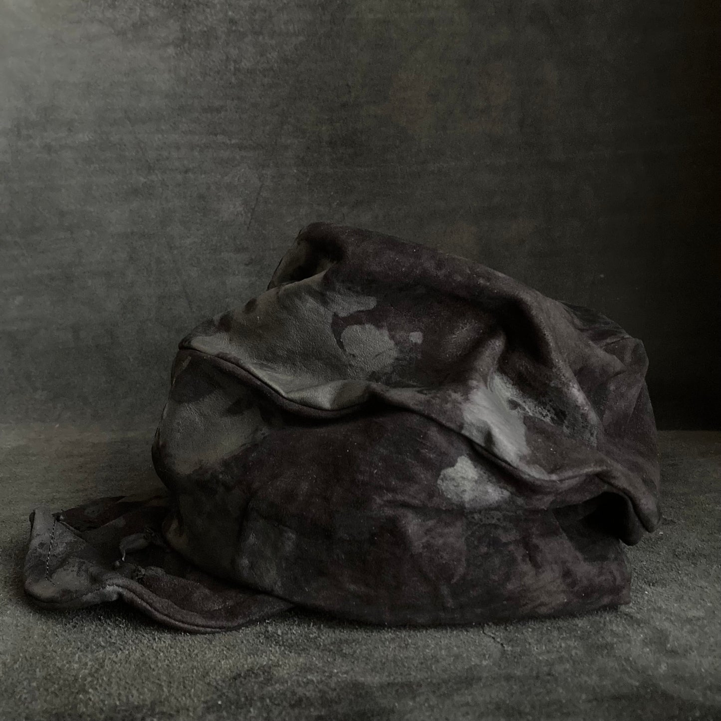 Bleached black leather turn cap