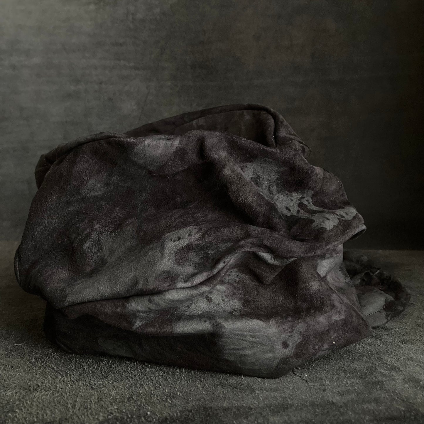 Bleached black leather turn cap