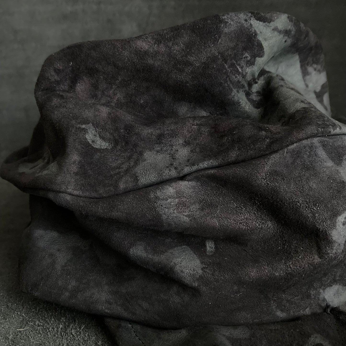 Bleached black leather turn cap