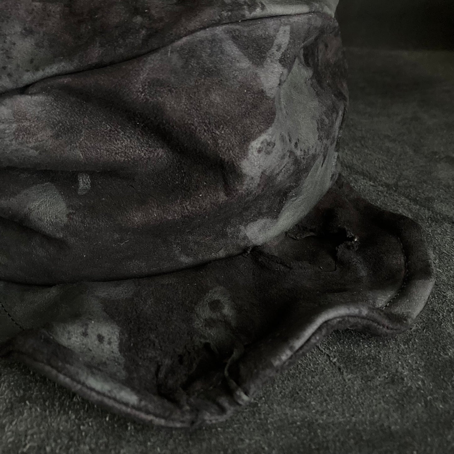 Bleached black leather turn cap