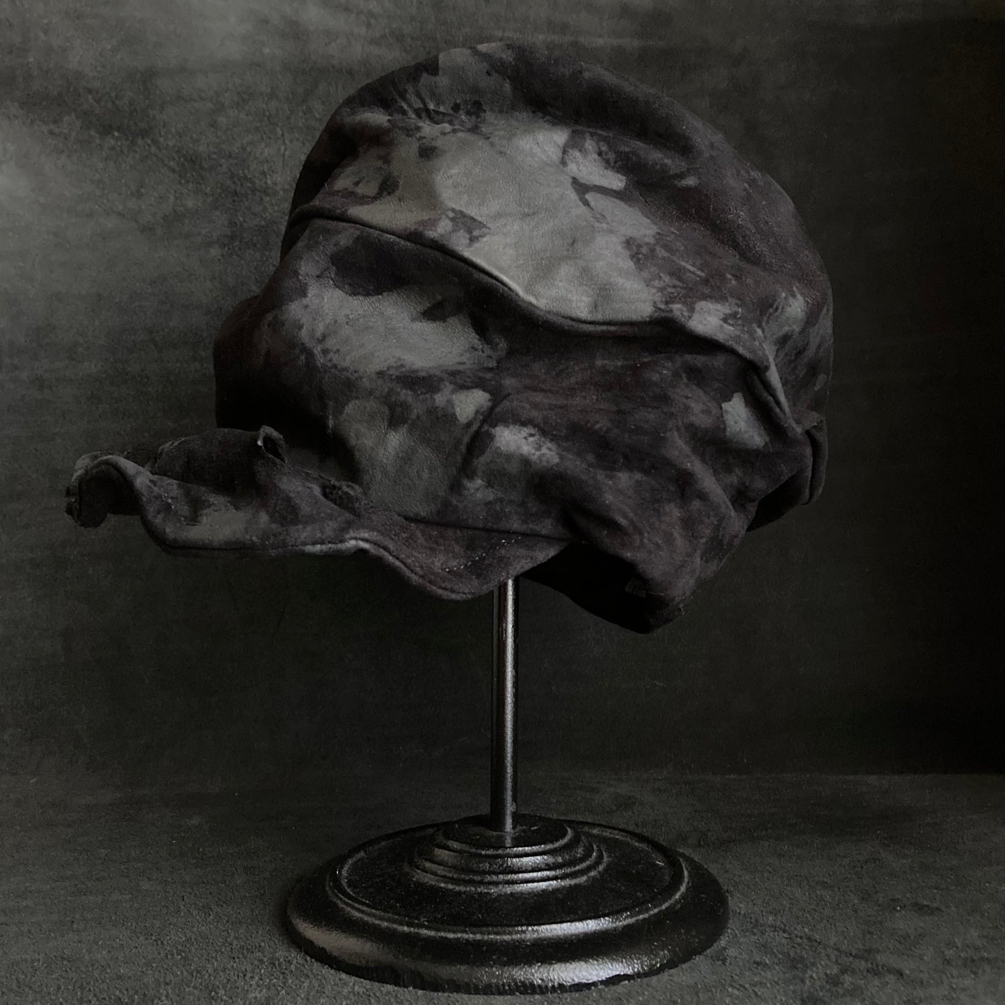 Bleached black leather turn cap