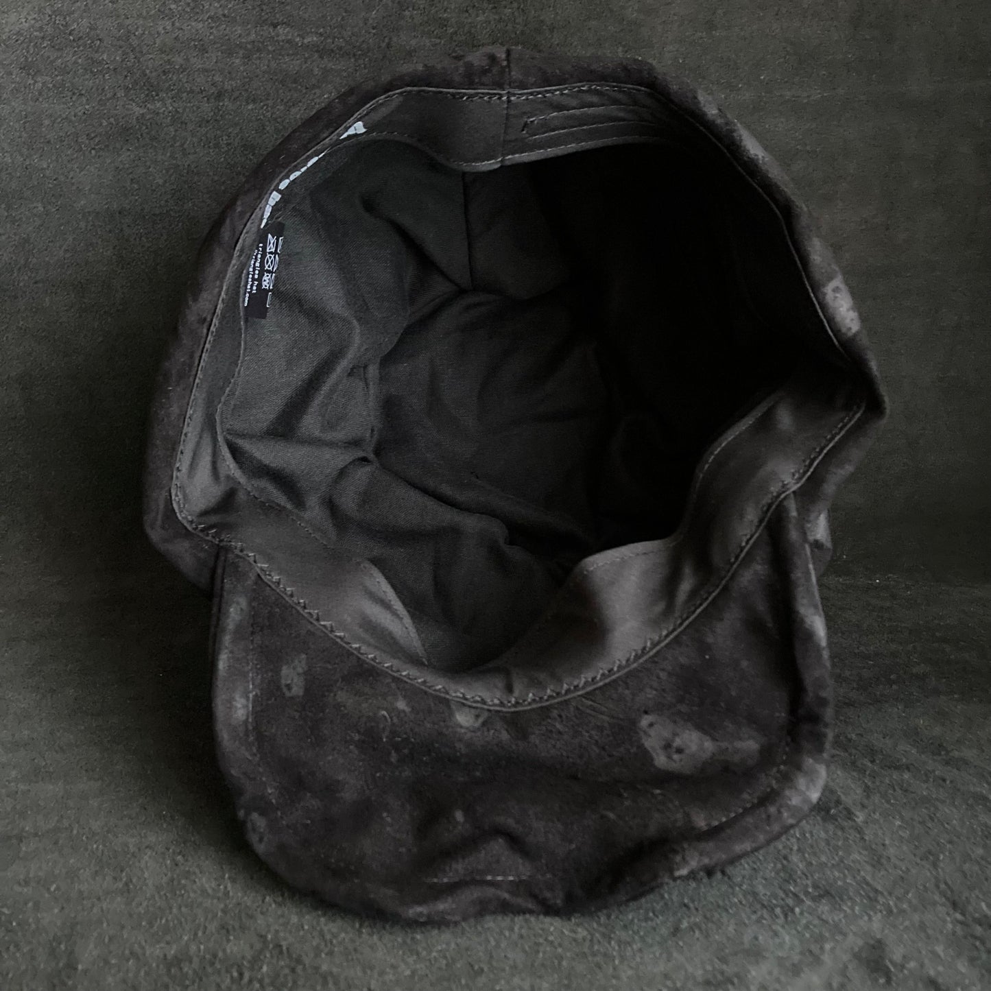 Bleached black leather turn cap