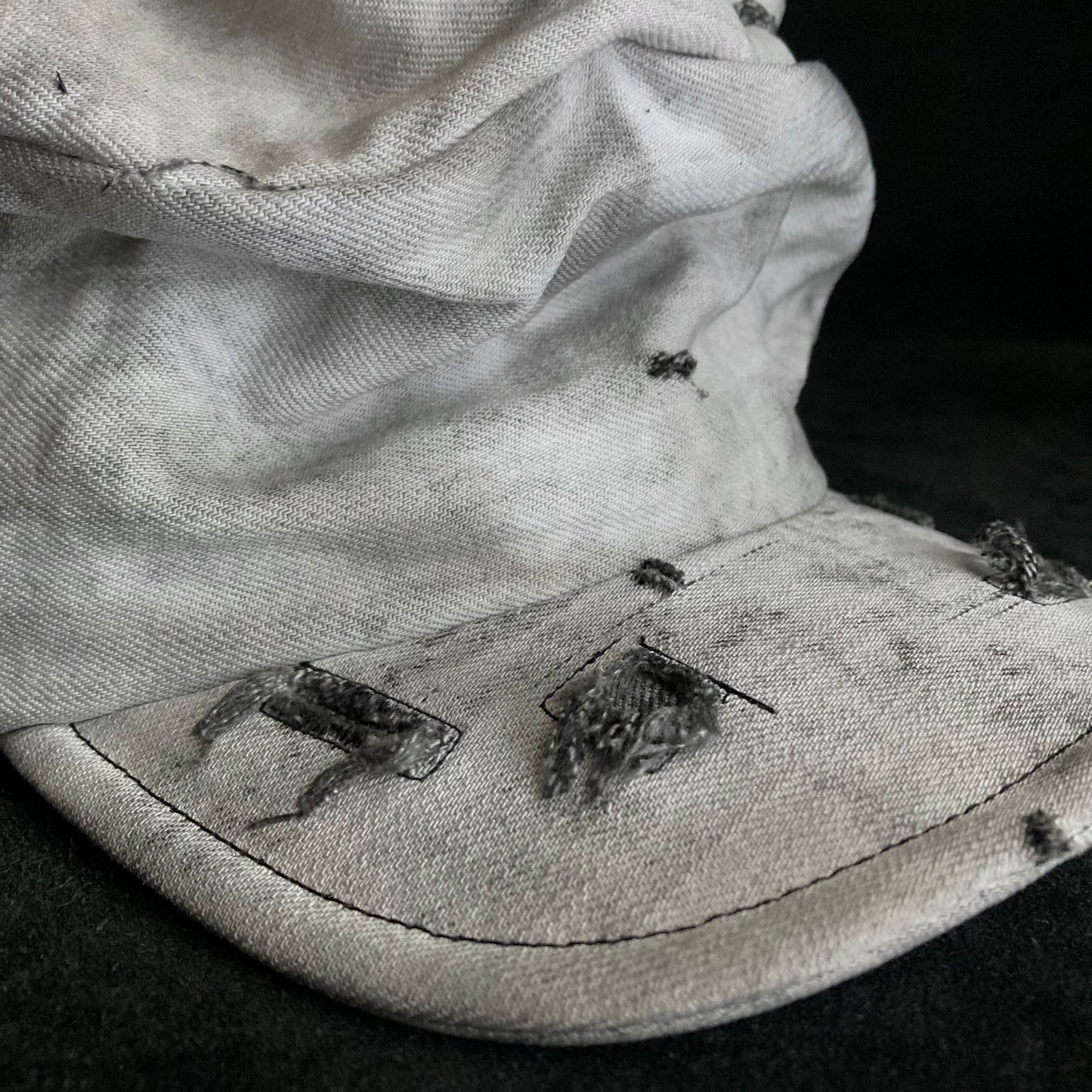 Hard bleached white/black denim turn cap