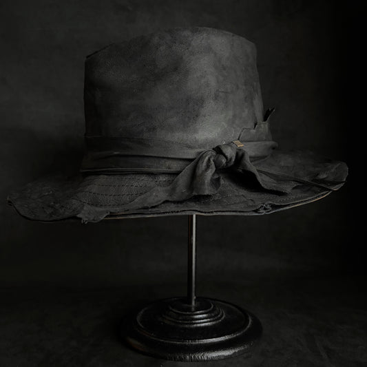 Faded black leather fedora hat
