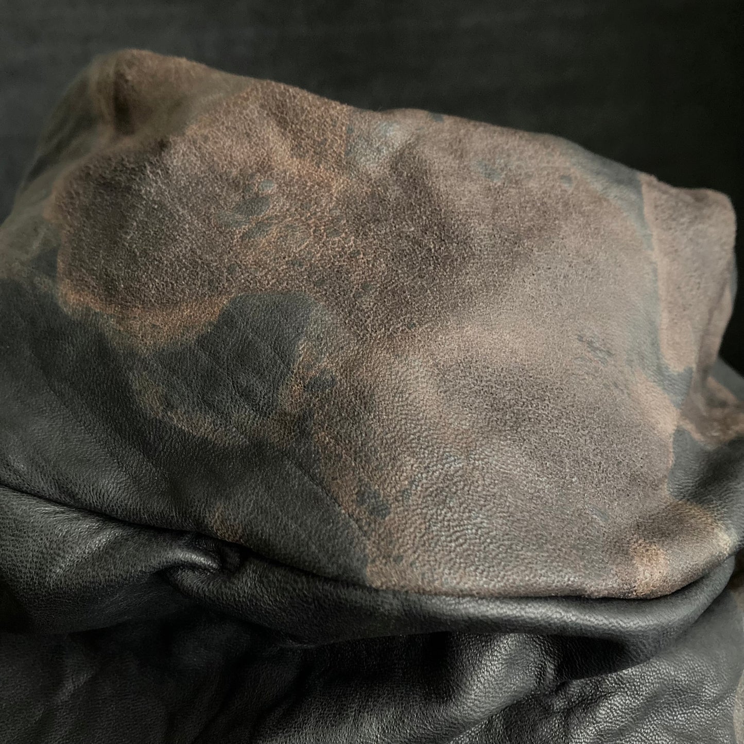 Discolored rusty leather turn cap