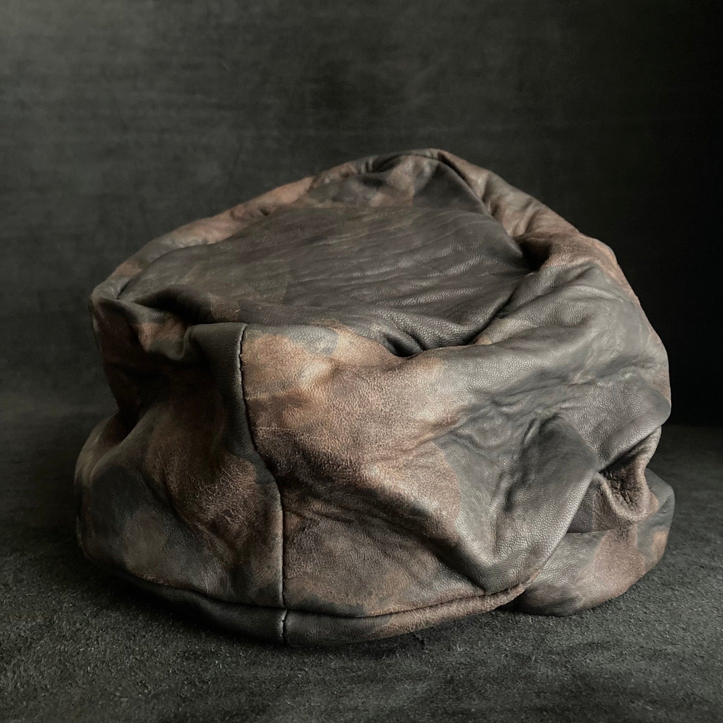 Discolored rusty leather turn cap