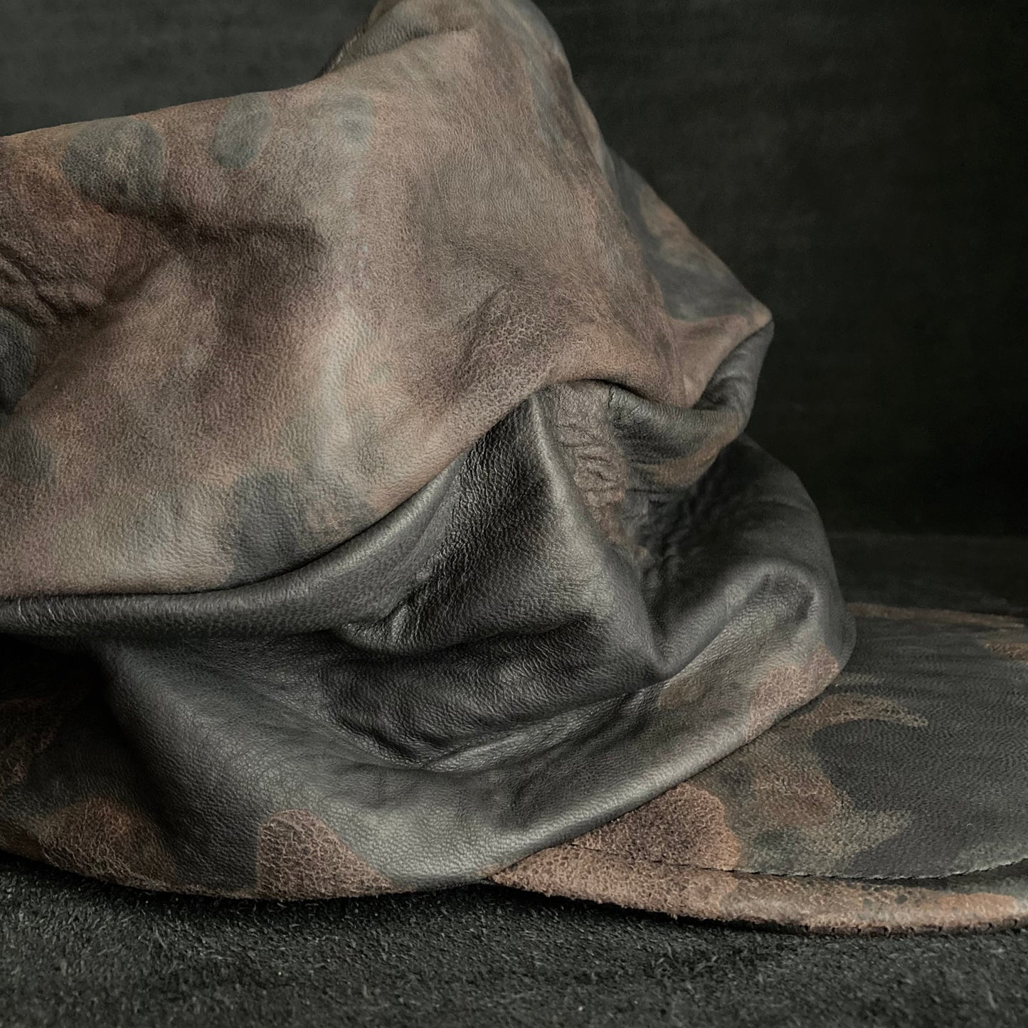 Discolored rusty leather turn cap