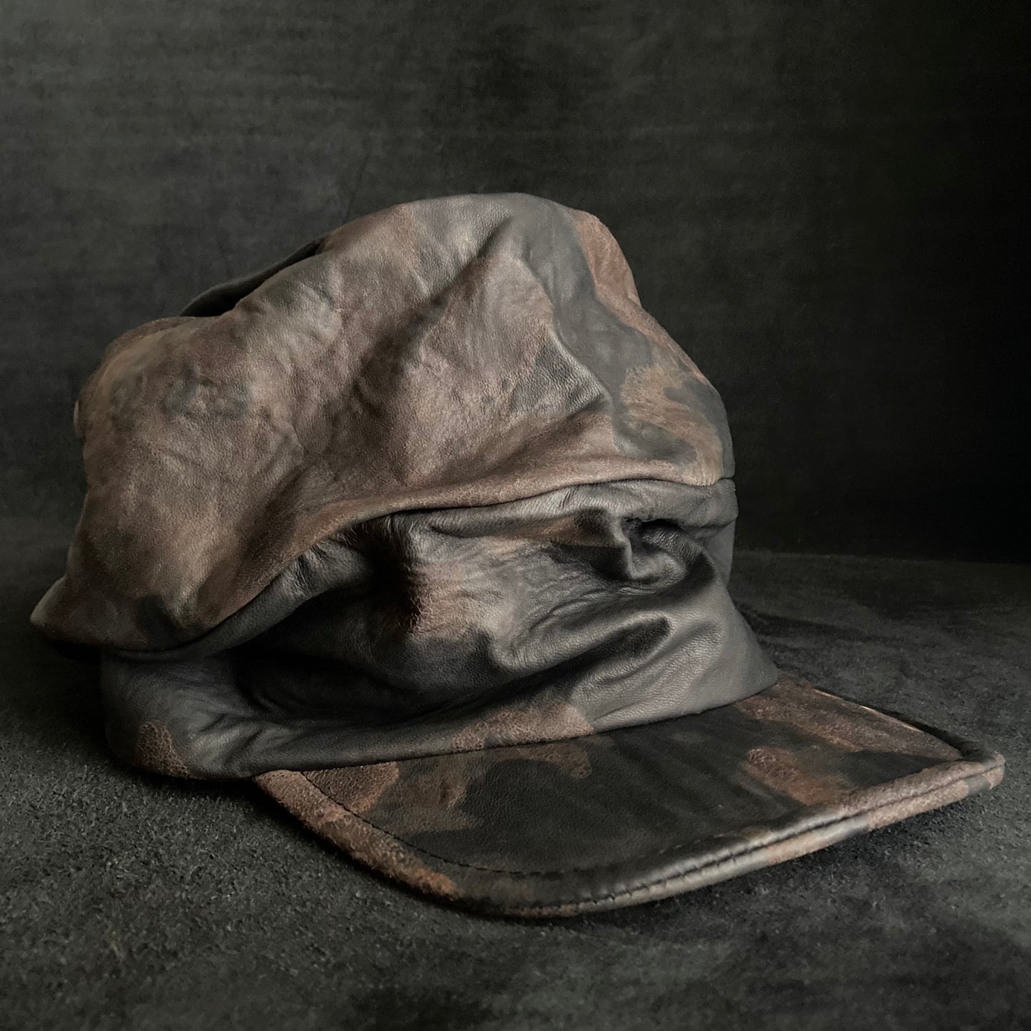 Discolored rusty leather turn cap