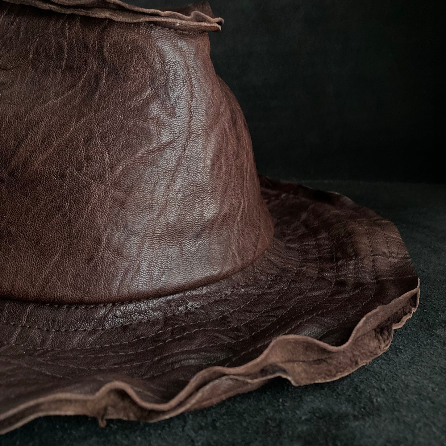 Wrinkled deep brown leather fedora hat