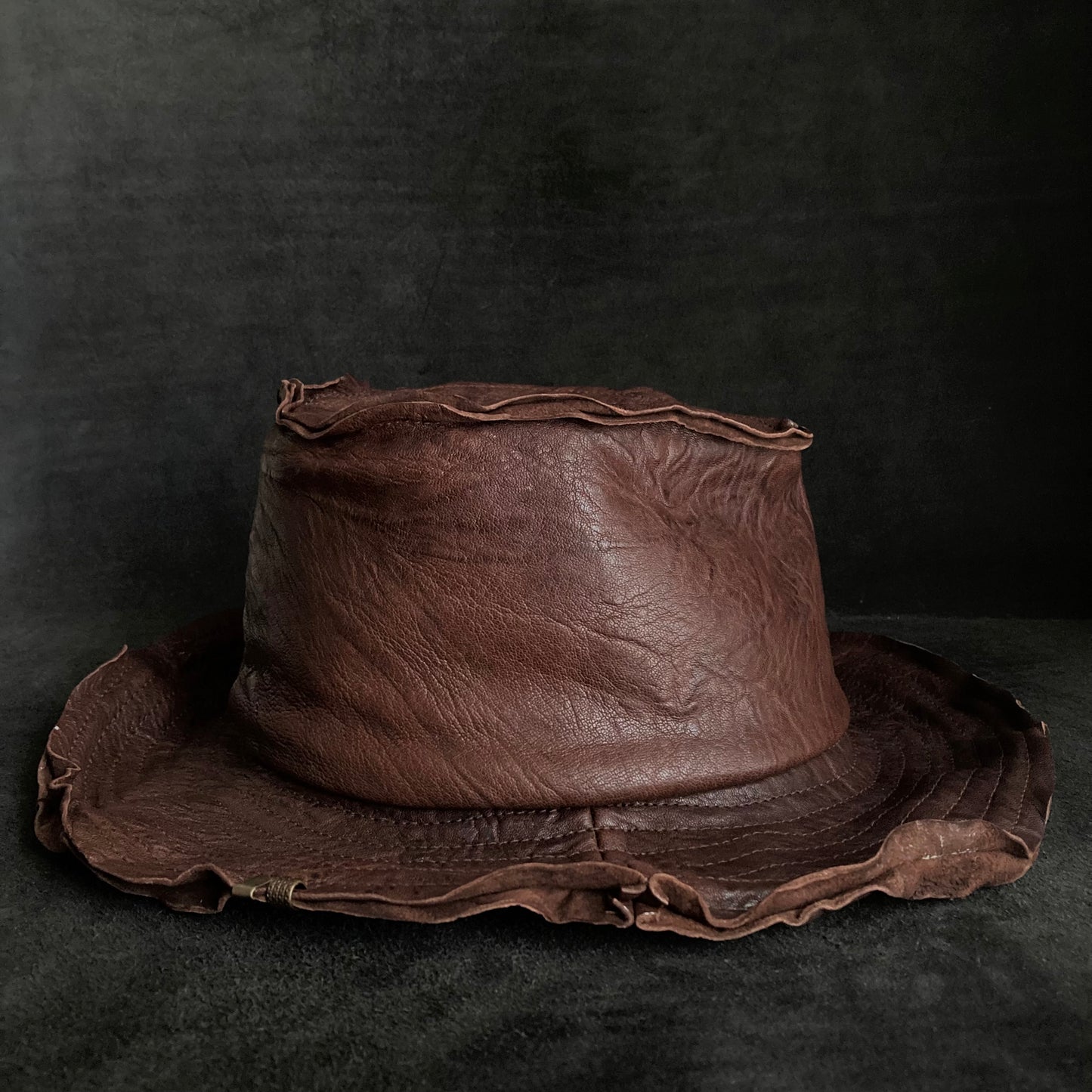 Wrinkled deep brown leather fedora hat