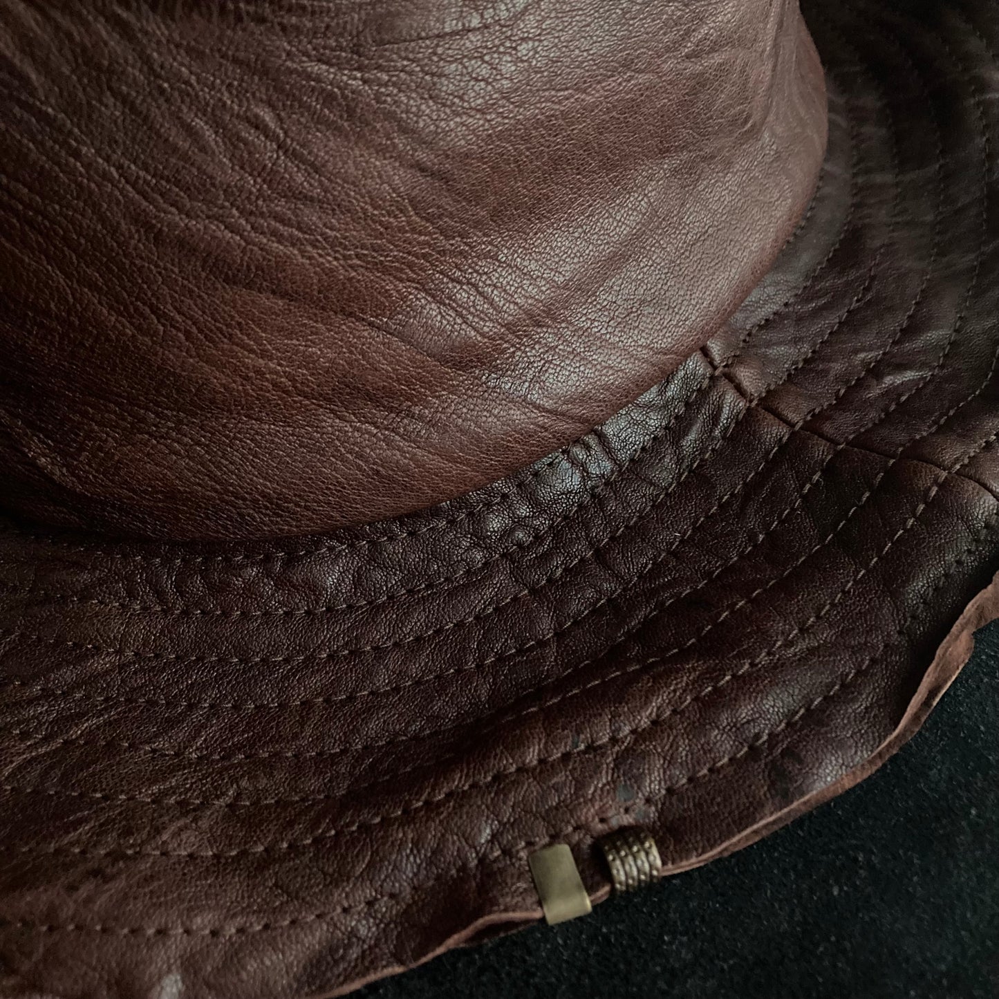 Wrinkled deep brown leather fedora hat