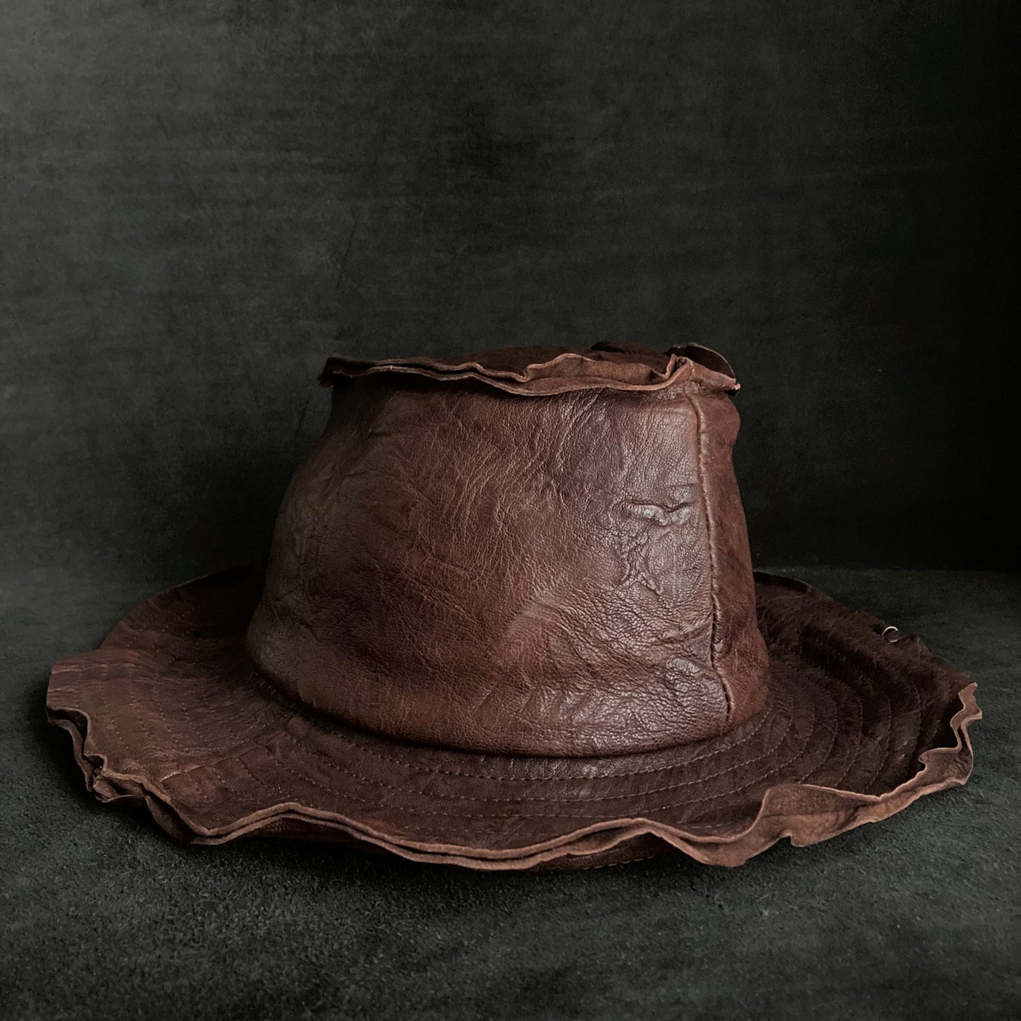Wrinkled deep brown leather fedora hat