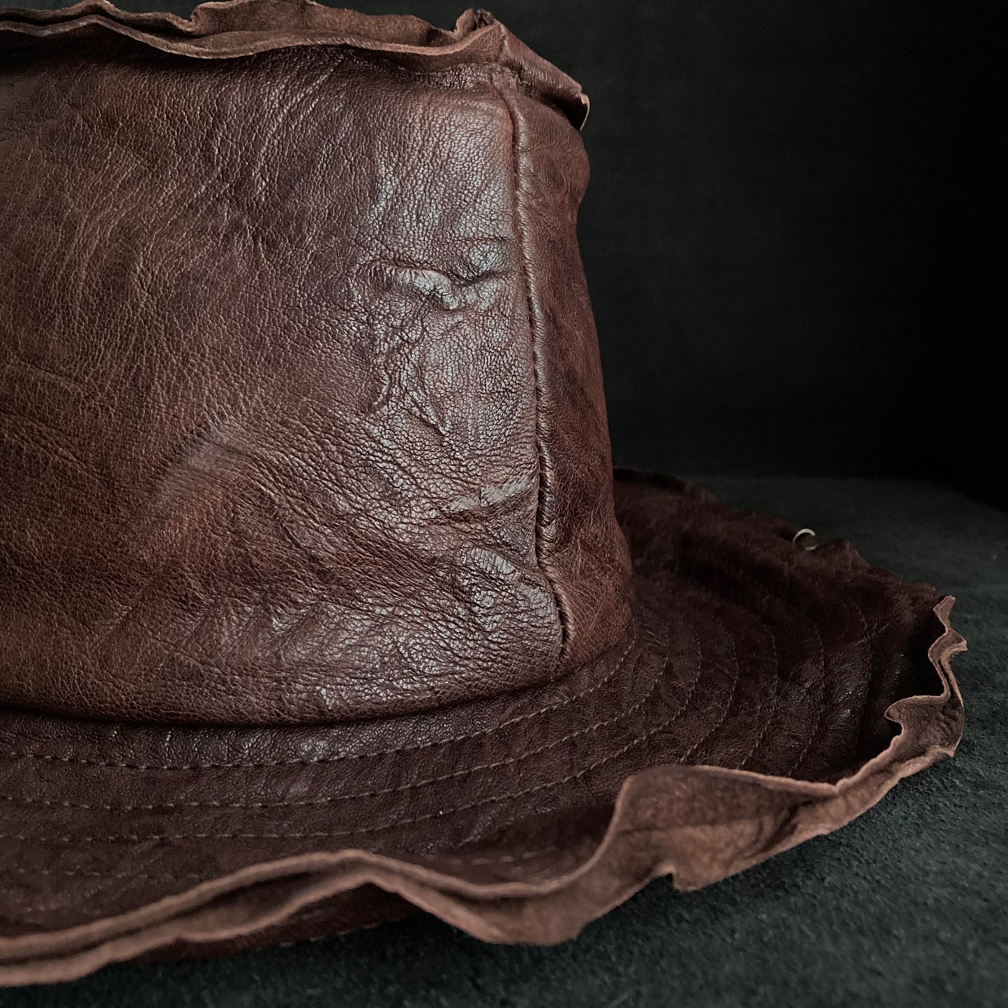 Wrinkled deep brown leather fedora hat