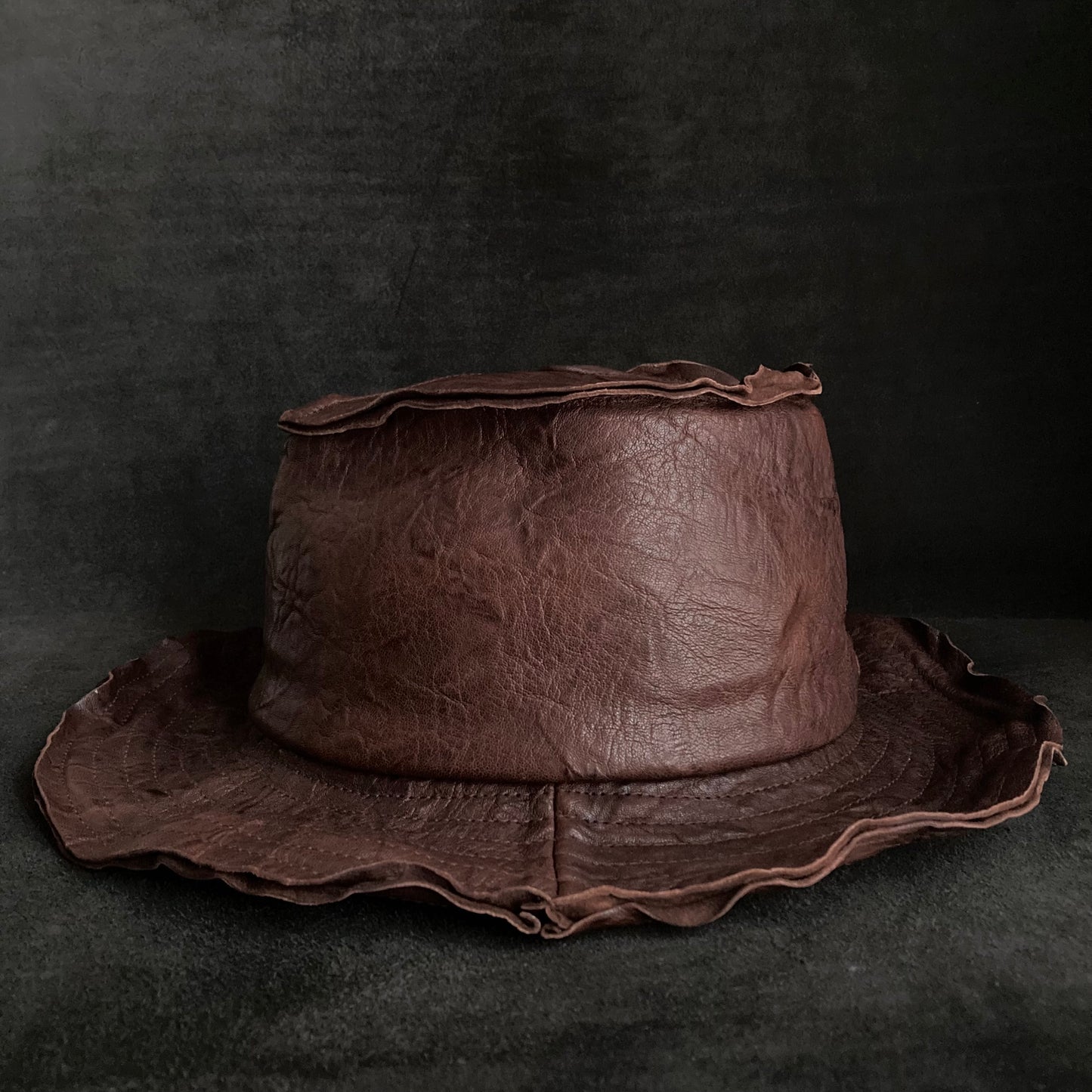 Wrinkled deep brown leather fedora hat