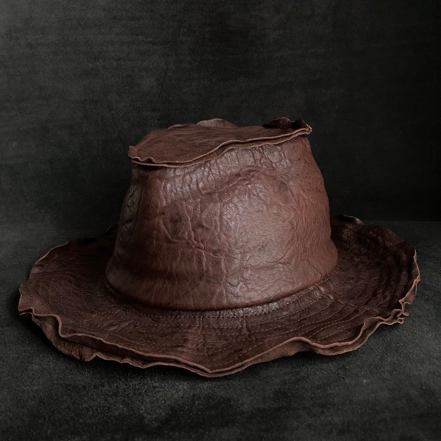 Wrinkled deep brown leather fedora hat