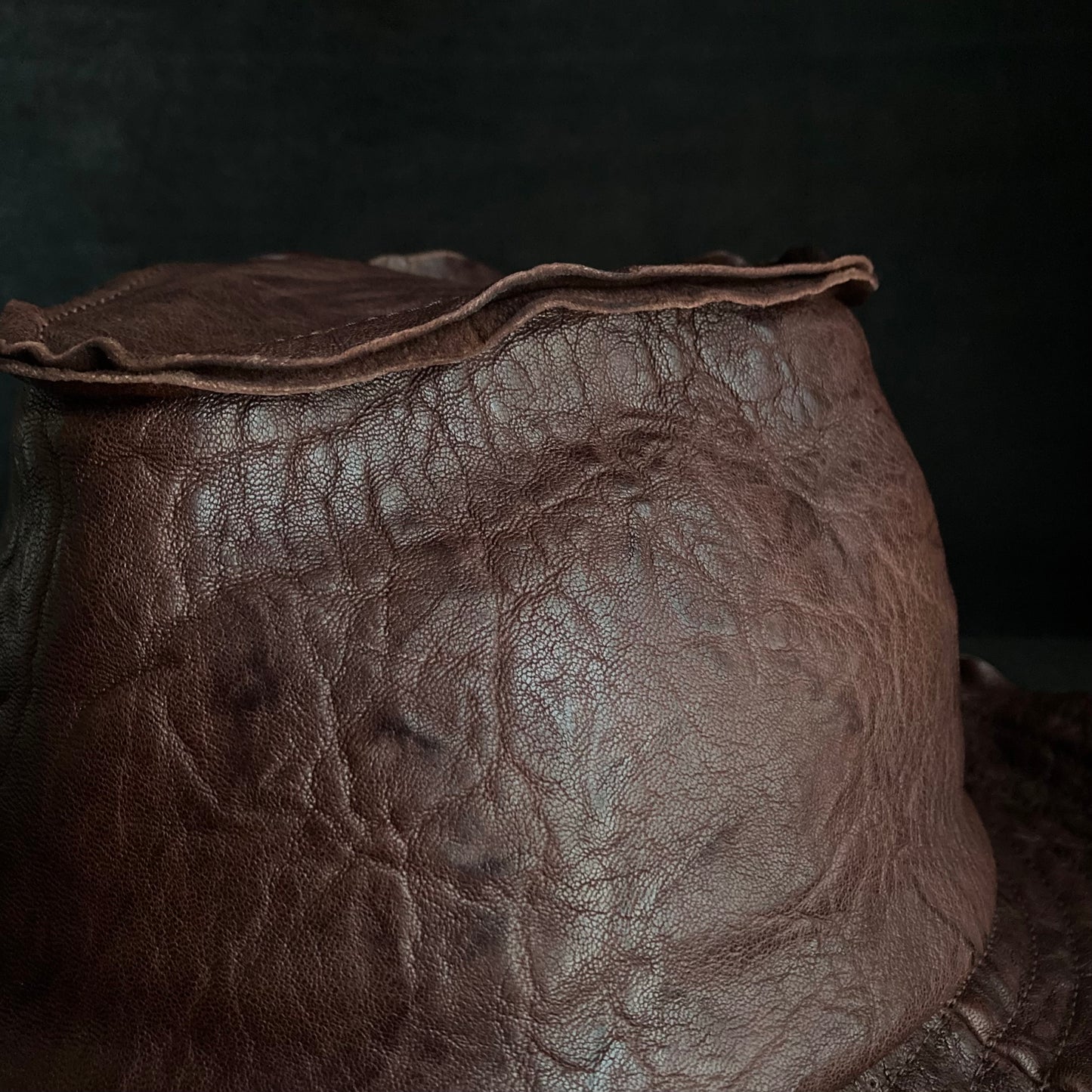 Wrinkled deep brown leather fedora hat