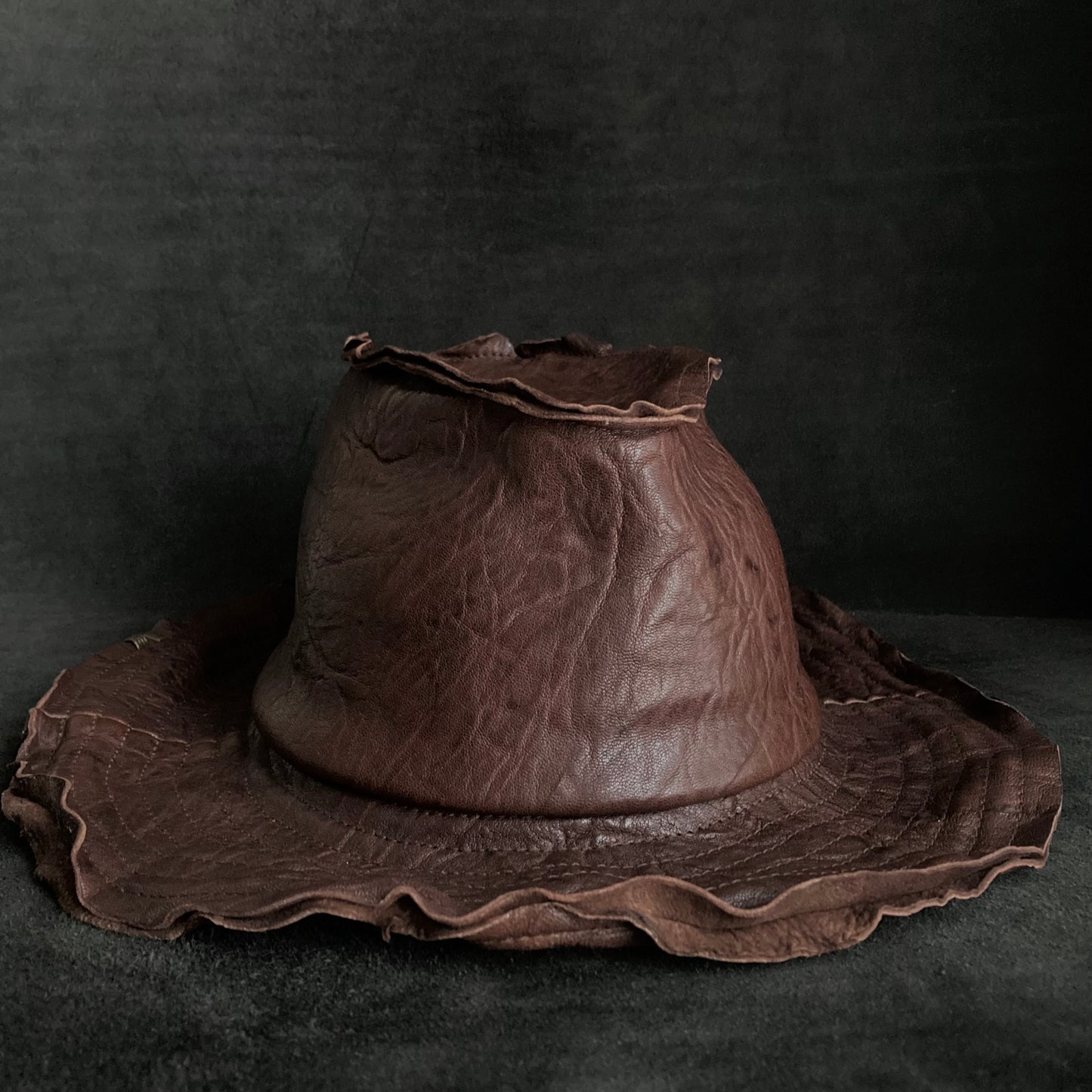 Wrinkled deep brown leather fedora hat