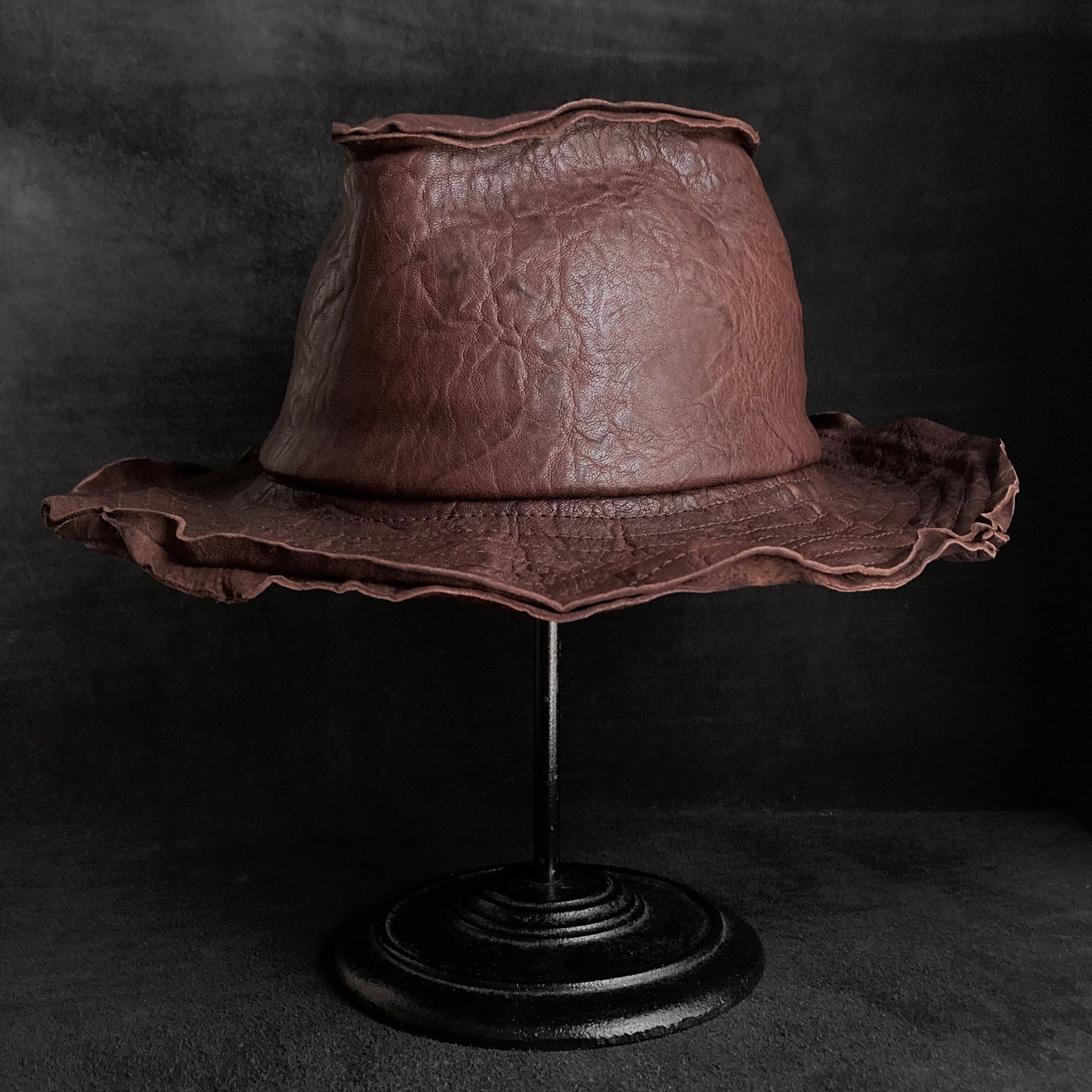 Wrinkled deep brown leather fedora hat