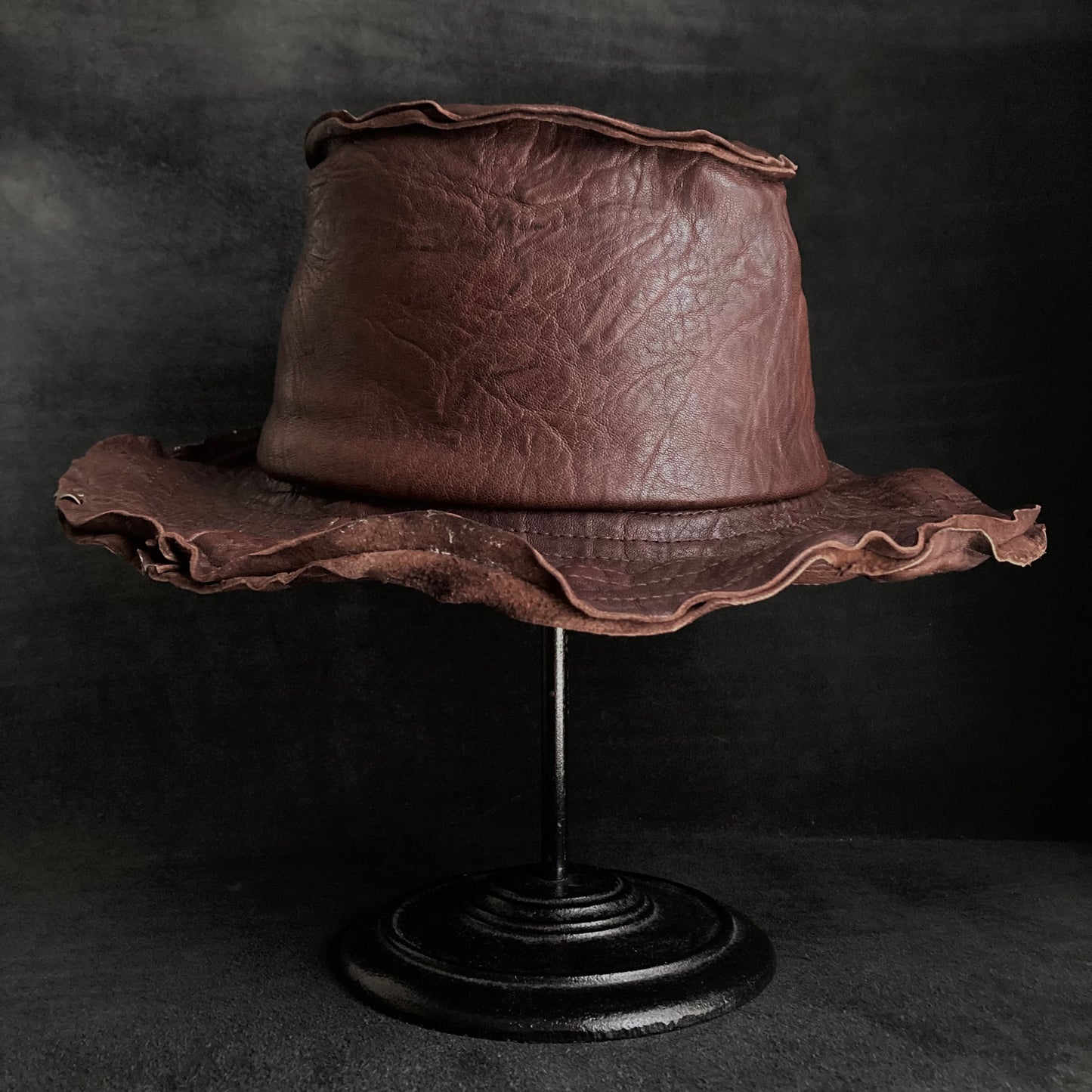 Wrinkled deep brown leather fedora hat